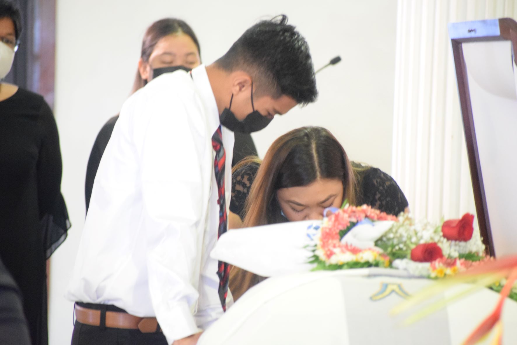 JC and Lily Ann say goodbye to their father  for the last time. 