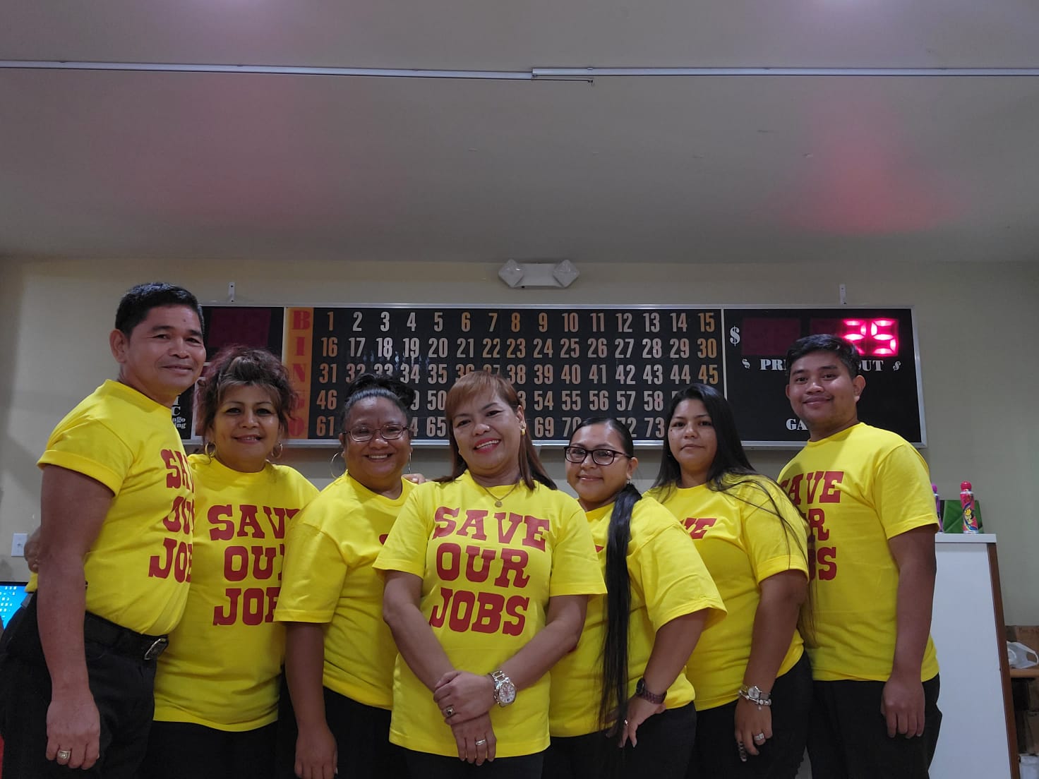 The employees of Saipan Vegas wear "Save our Jobs" T-shirts on Sunday.