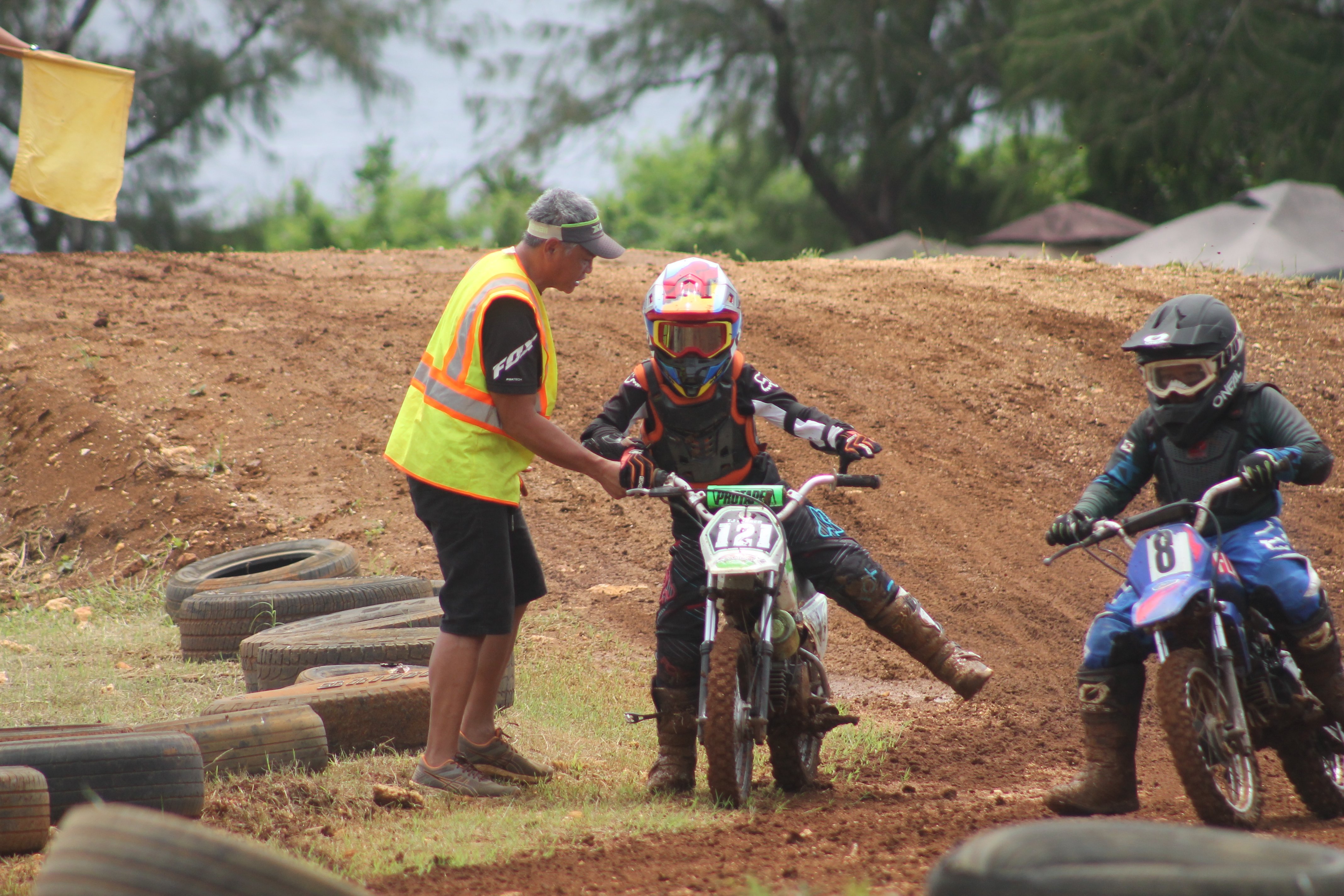 TJ Ferrer gets help as he tries to get back on the track during the Minis 2 Class race at Cowtown Raceway Park.