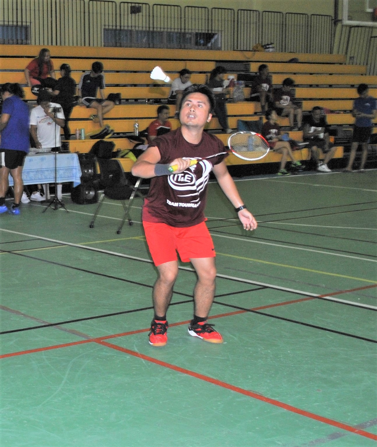 Shirley's Andreau Galvez gathers for the backhand return during an A Men's Doubles match of the IT&E Badminton Tournament at the Ada gym on Saturday.