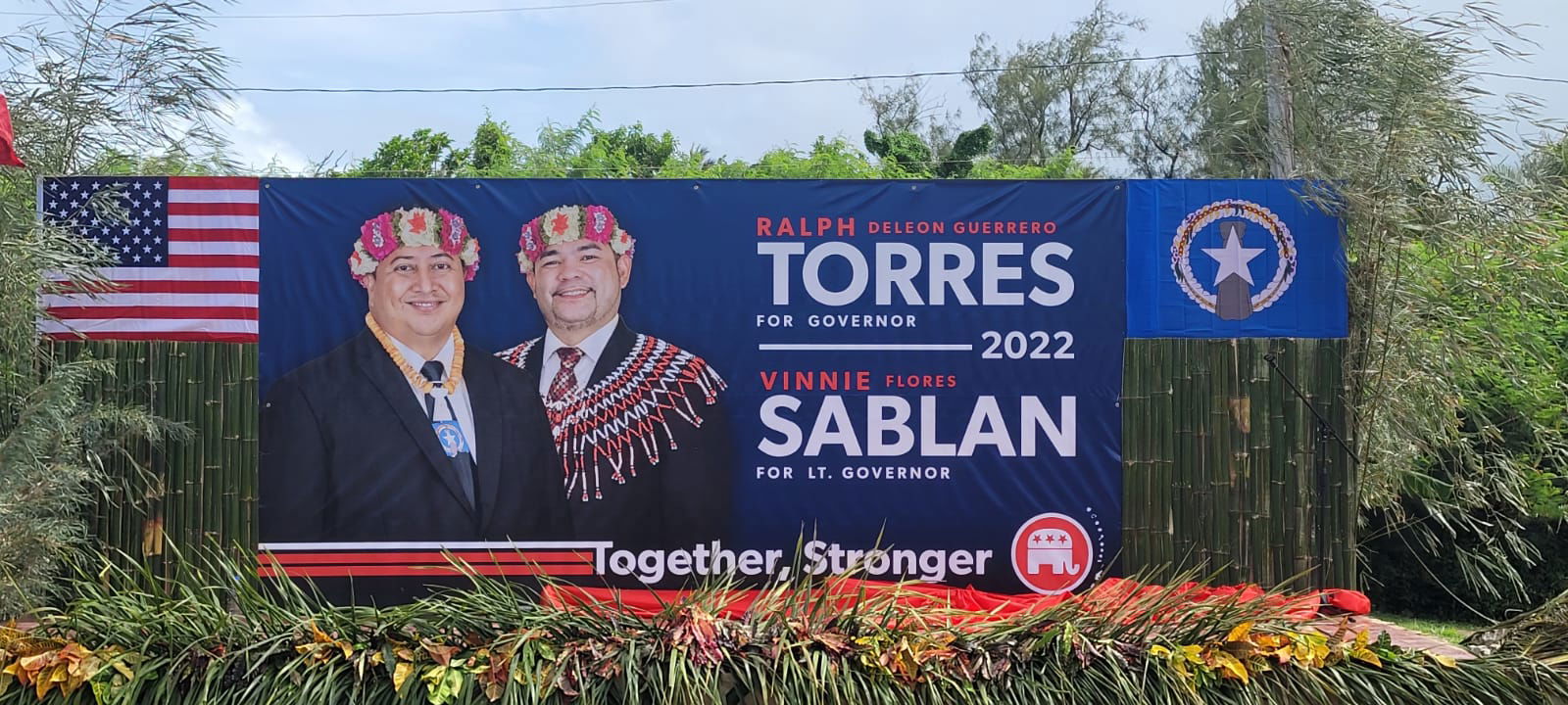 A campaign sign of the Republican tandem is displayed Sunday at the governor's residence in As Teo.