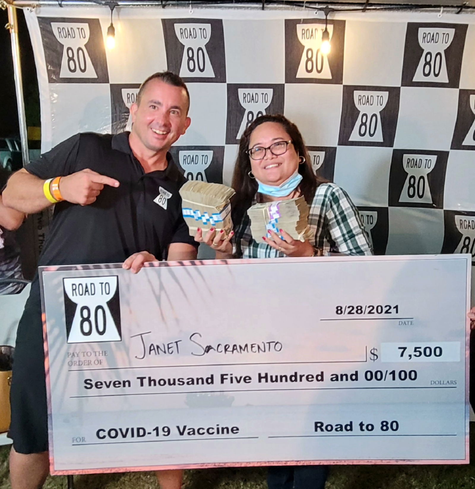 Campaign spokesperson Brad Ruszala poses for a photo with Janet Sacramento, winner of the bonus $7,500 cash prize.