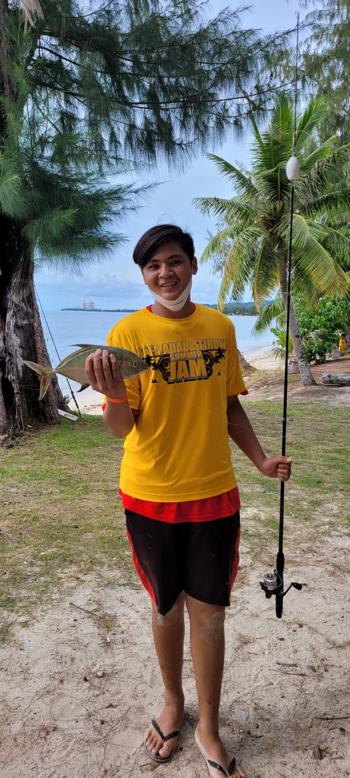 Charlz Sanchez caught the first fish, a skipjack, during the kids' fishing derby on Saturday. 
