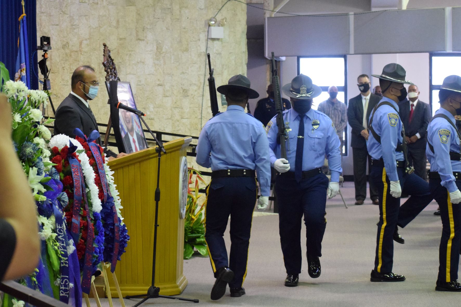 The color guard march out of the multi-purpose center at the conclusion of the state funeral.