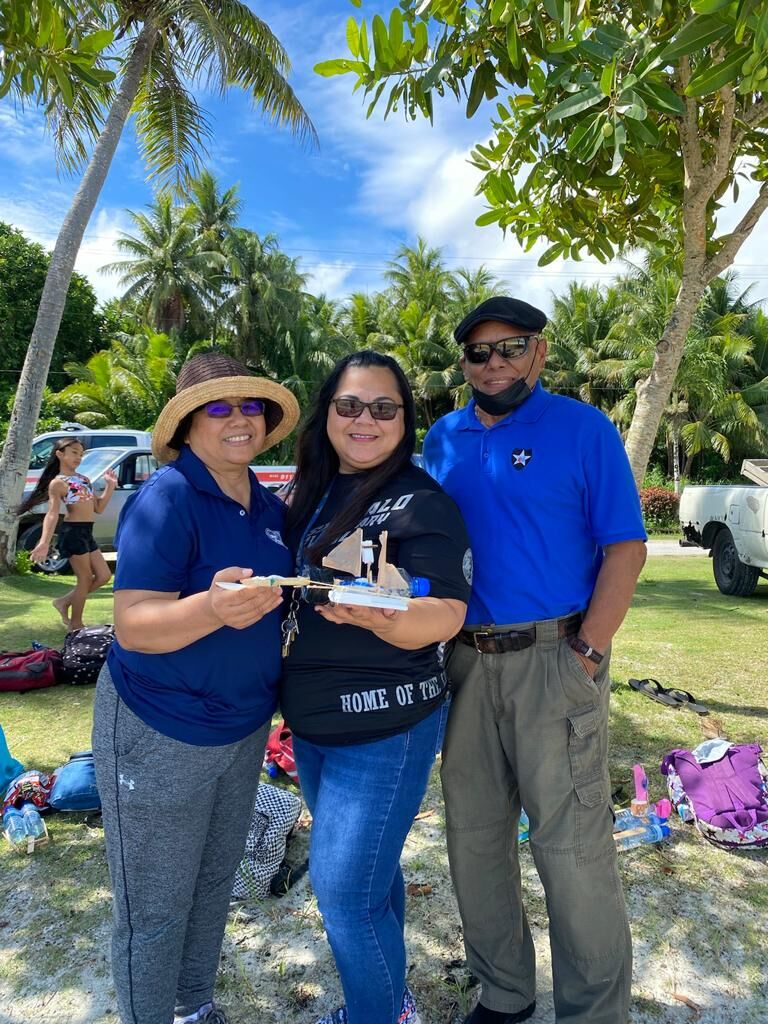 Public School System Senior Director for Curriculum and Instruction Jackie Quitugua and Board of Education Vice Chairman Herman Atalig pose for a photo with Sinapalo Elementary School principal Daisy Quitugua, center,  during one of the summer fun activities for students on Rota.