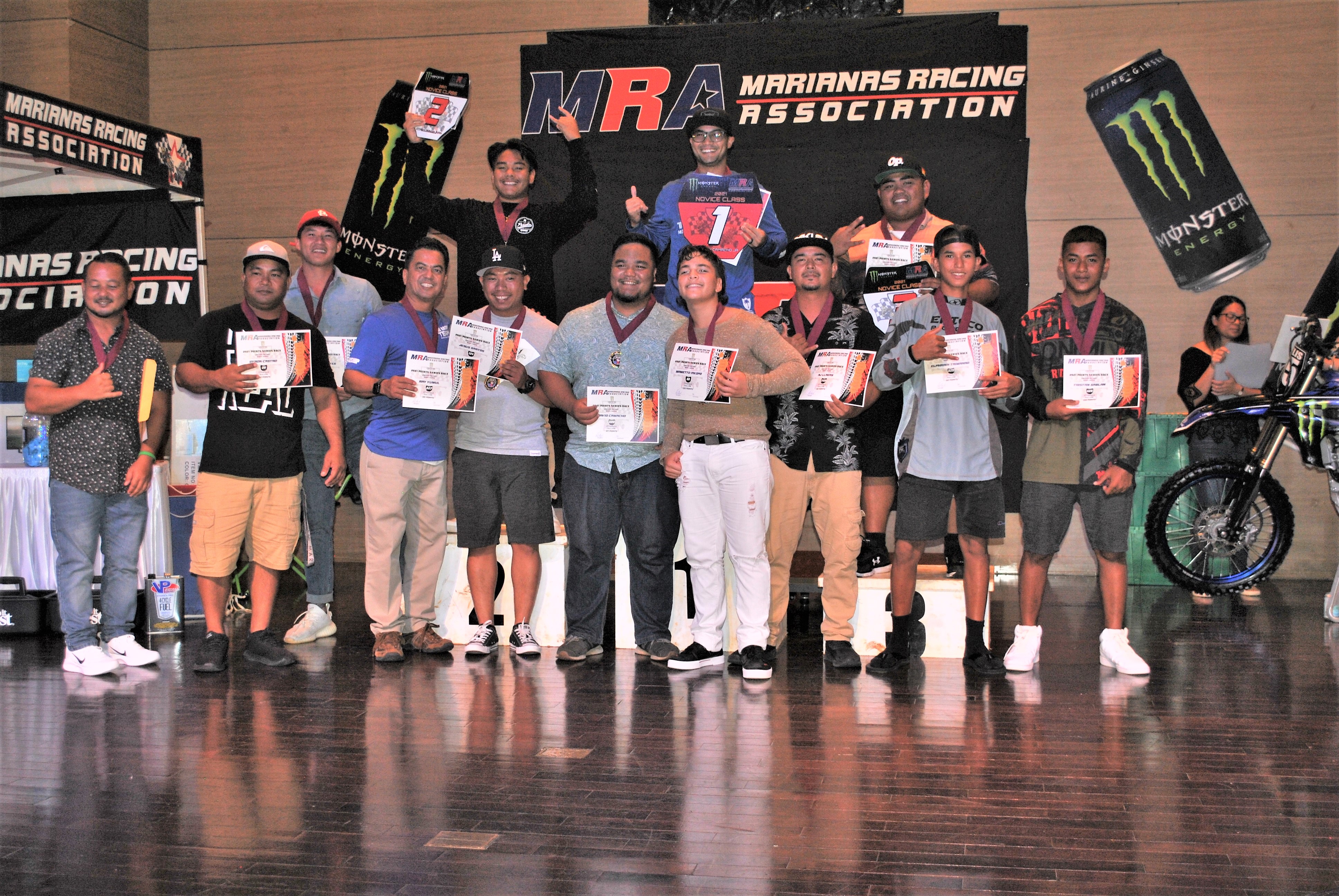 The Novice Class riders pose for a photo with their certificates during the awards banquet at Saipan World Resort on July 28.