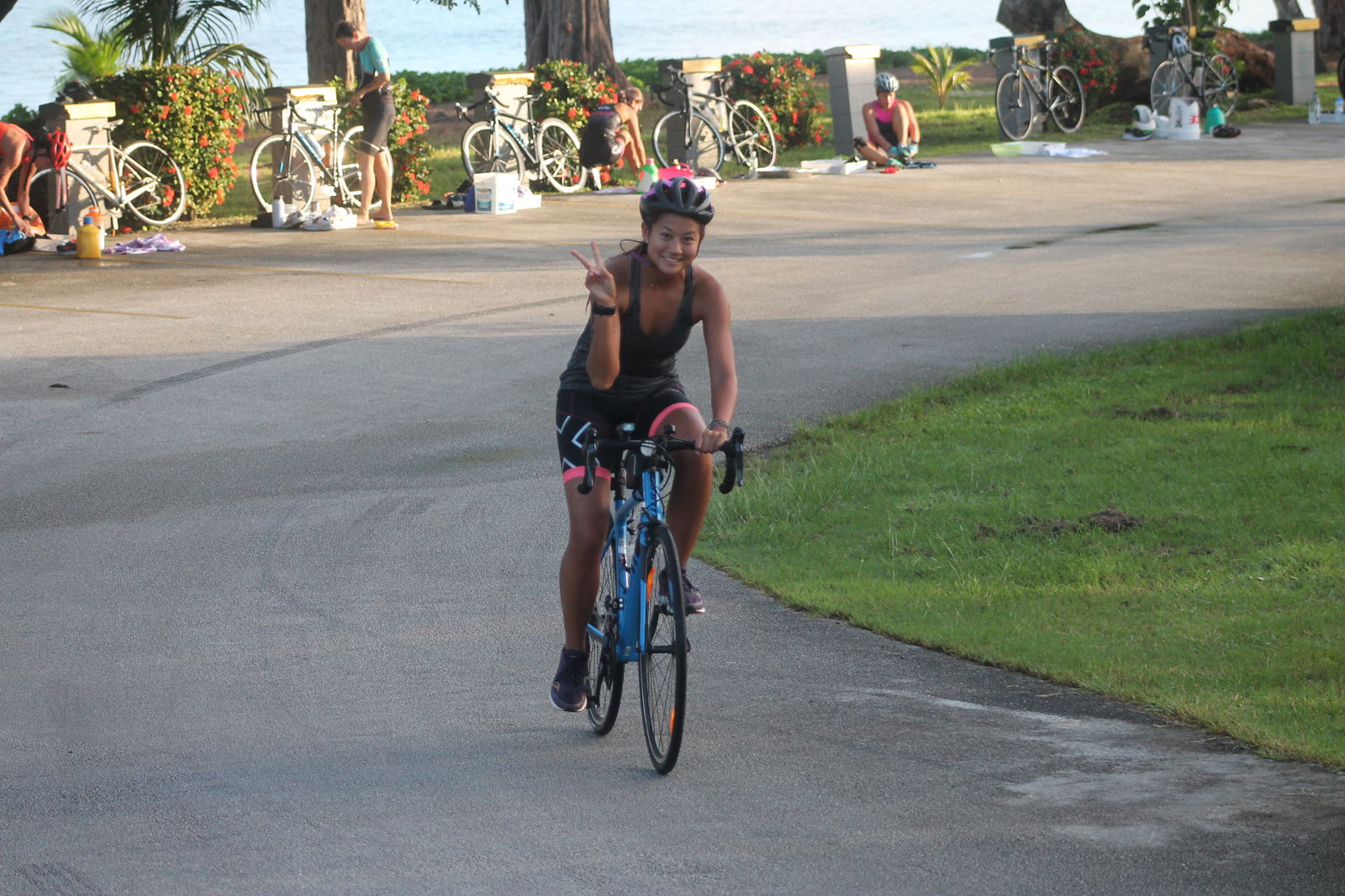 Tania Tan smiles as she starts the bike leg.
