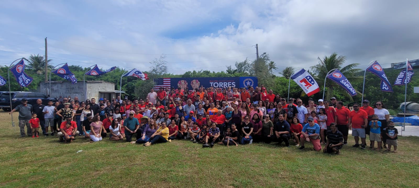Gov. Ralph DLG Torres and running-mate Senate Floor Leader Vinnie F. Sablan pose with their family members and other supporters at the governor's As Teo residence on Sunday.