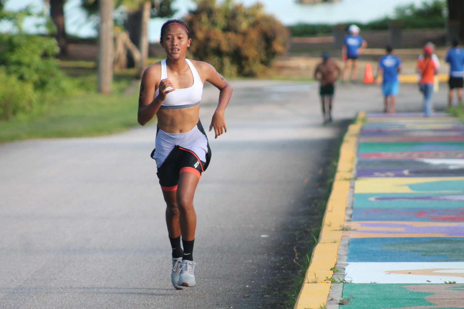 Kaithlyn Chavez runs uphill.