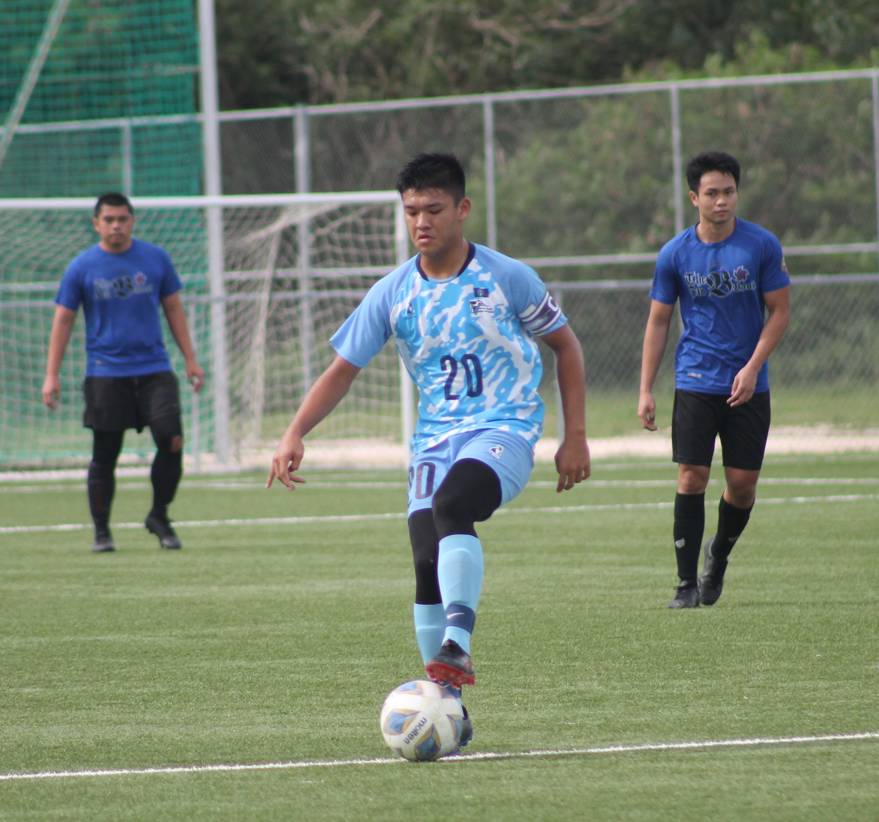 NMI U18's Taka Borja sets up the play  during a Men's Soccer League Summer 2021 game at the NMI Soccer Training Center.