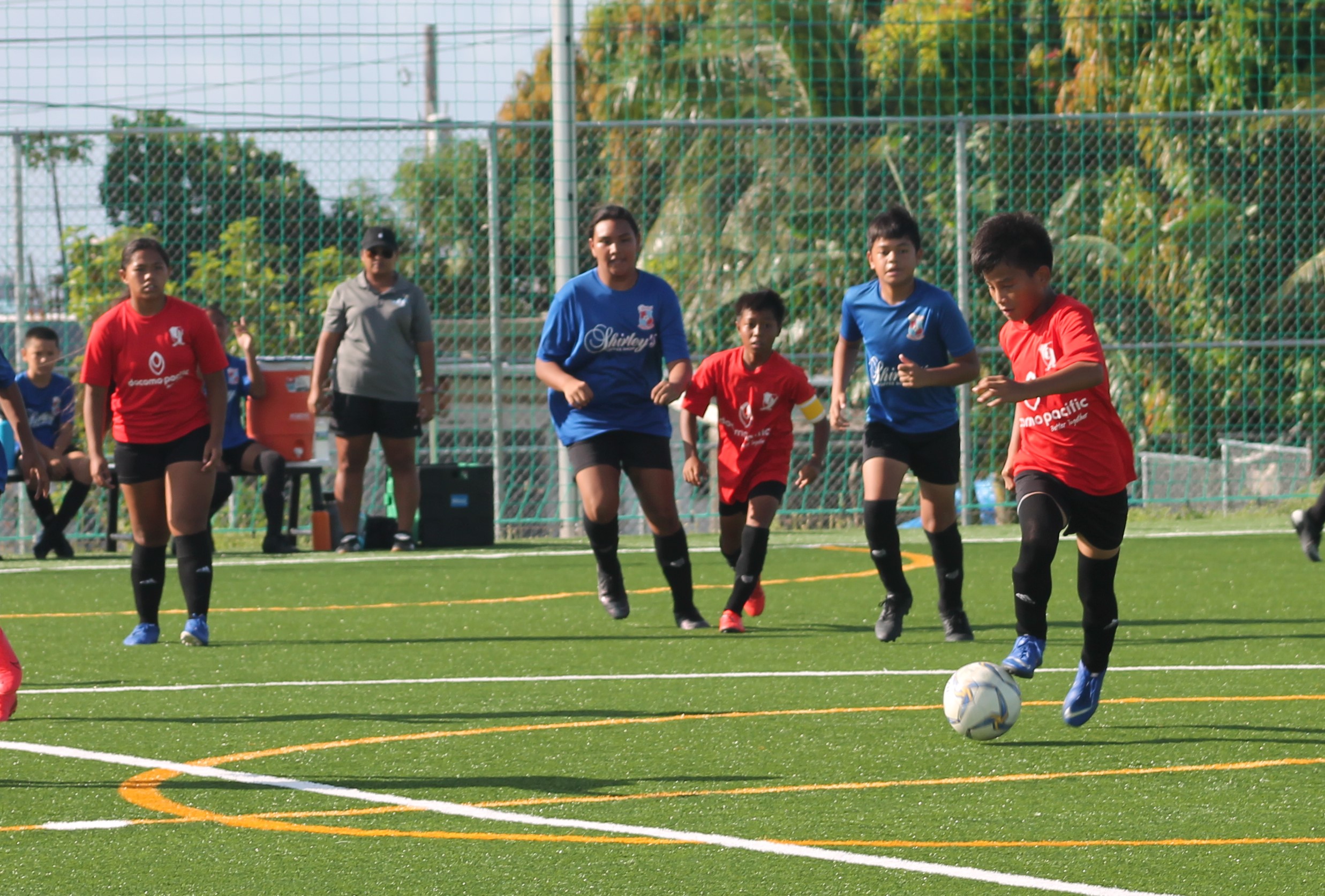 Paire’s Jayten Villagomez sets up the play in the U12 Coed Division championship game of the Youth League Summer 2021 at the NMI Soccer Training Center on Saturday.