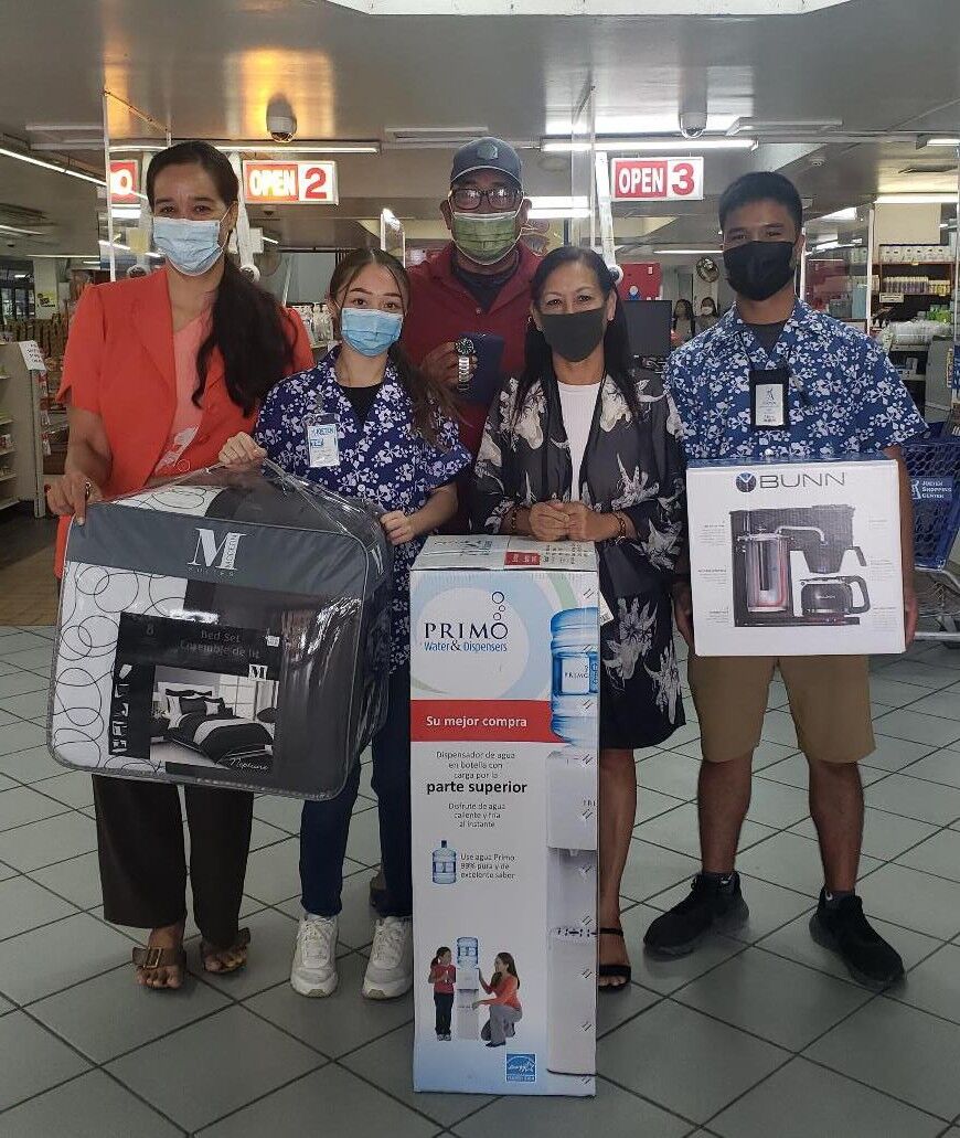 Deborah Deleon Guerrero of Joeten Enterprises, second right, donates over $1,000 in merchandise on Aug. 3, 2021, for the 19th Annual HANMI Charity Classic Golf Tournament slated for Aug. 14, 2021, at Coral Ocean Resort on Saipan.  From left, tournament committee member Catherine Perry, Kaia Travilla, tournament committee member Tony Satur, Deleon Guerrero, and Marc Mendiola.
