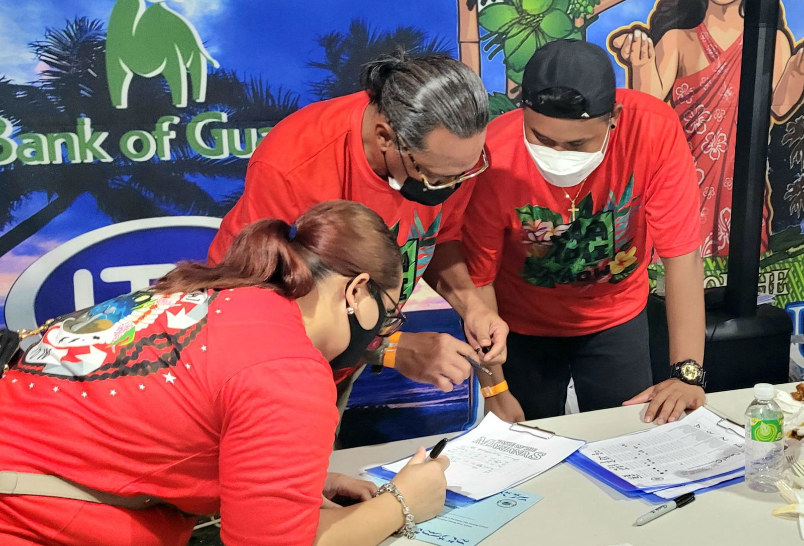 MVA representatives tabulate the judges' scores in the Kadun Pika cooking contest.