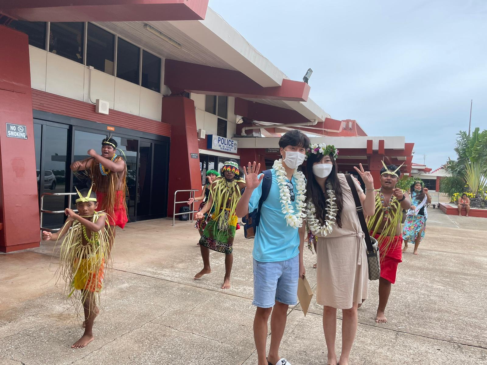 Passengers from South Korea are greeted at the Francisco C. Ada/Saipan International Airport with indigenous Chamorro and Carolinian dancers on July 24, 2021.