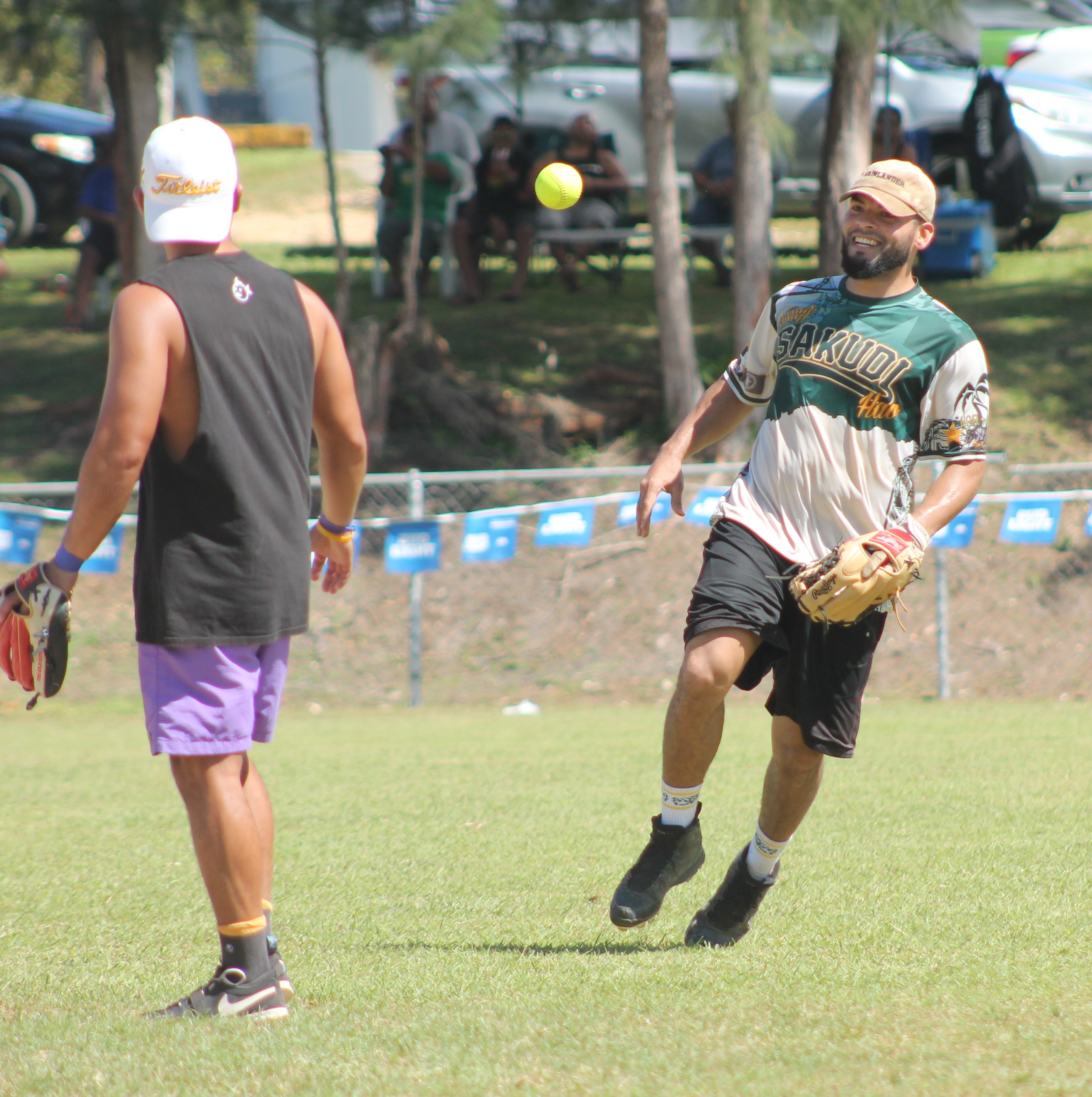 The Kliq's Eli smiles as he gets the out and passes the ball to the second baseman during a King of the Diamonds Labor Day Softball Tournament game presented by Roil Soil Marketing at the Capital Hill ballfield on Sunday.