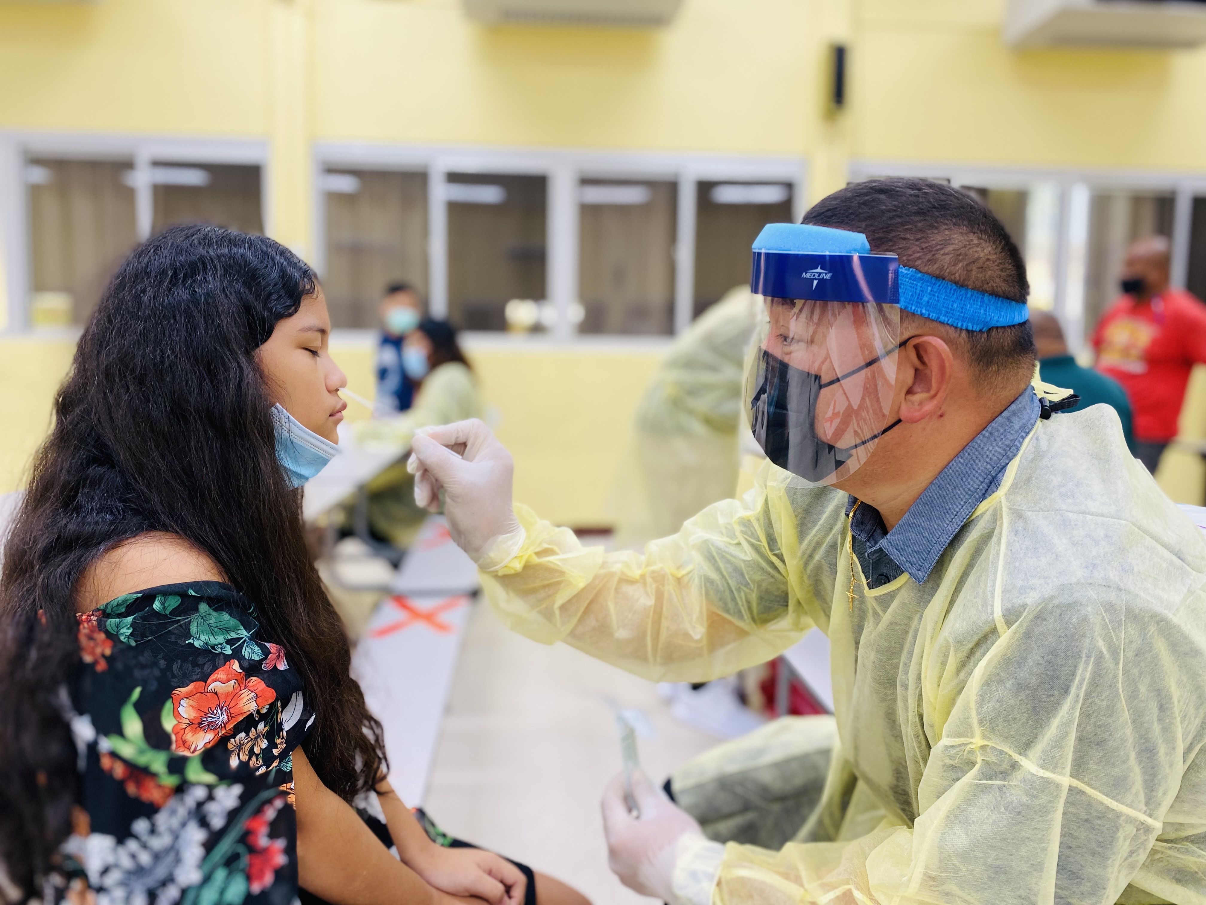 Isabella Cabrera, a fifth grader at GTC, receives an antigen test from Jesse Tudela, CHCC’s chief of ancillary services.