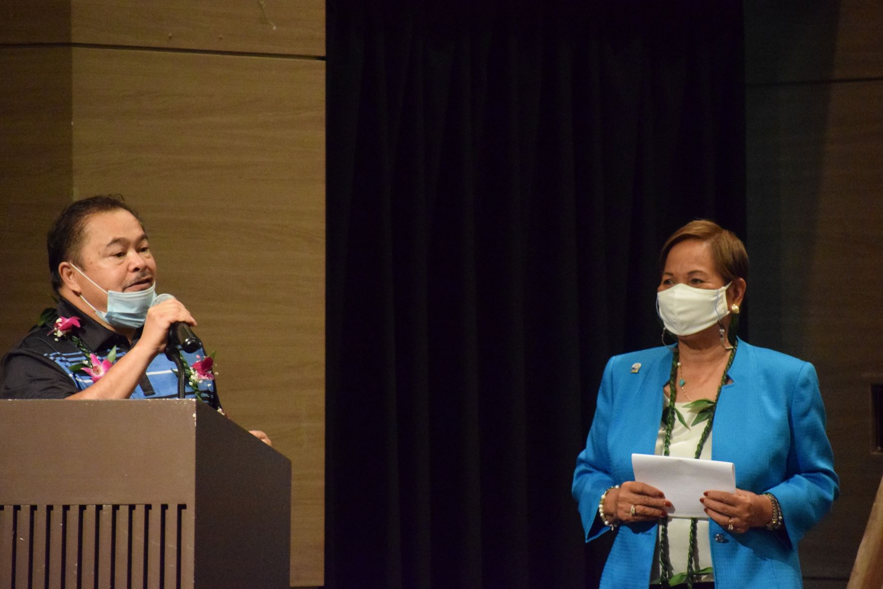 Education Commissioner Alfred B. Ada, left, speaks while Guam Marianas Training Center Chief Executive Officer Fe Valencia-Ovalles listens during the completion ceremony for the certified nursing assistant summer program at Saipan World Resort on Sunday.