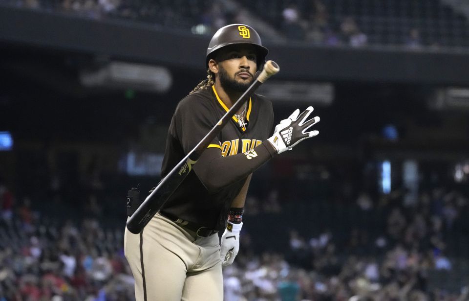 San Diego Padres right fielder Fernando Tatis Jr. (23) tosses his bat after hitting a solo home run against the Arizona Diamondbacks in the first inning at Chase Field in Phoenix, Arizona on Aug 15, 2021.