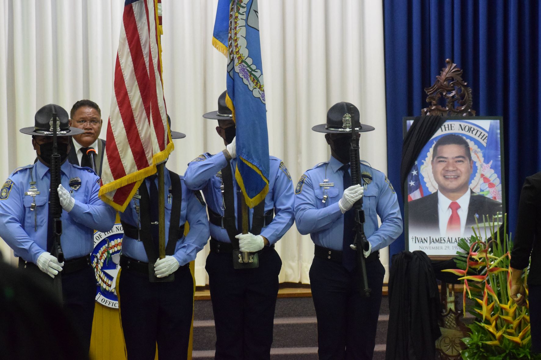Department of Lands and Natural Resources special assistant to the secretary, Gus Kaipat, sings the national anthem as the color guard stand at attention.