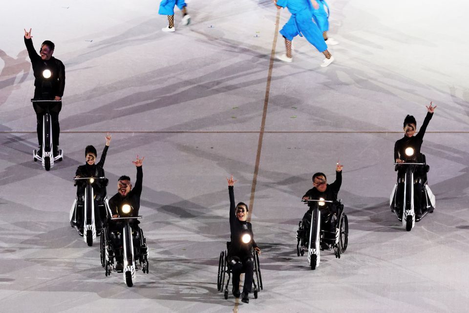 Performers gesture during the opening ceremony of the Tokyo 2020 Paralympic Games at the Olympic Stadium in Tokyo on Aug. 24, 2021.