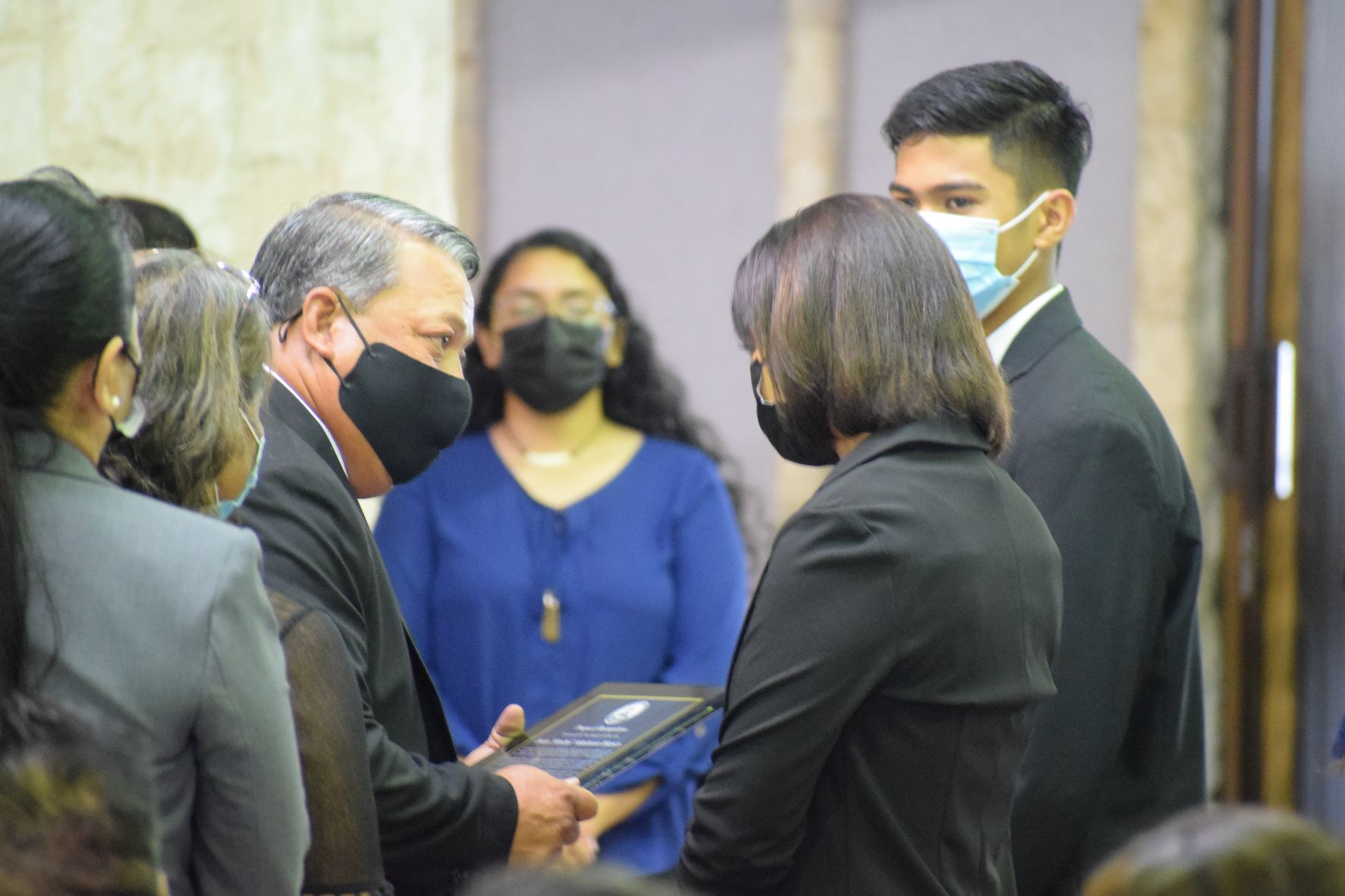 Tinian Mayor Edwin Aldan presents a tribute to the family of Rep. Ivan Blanco.