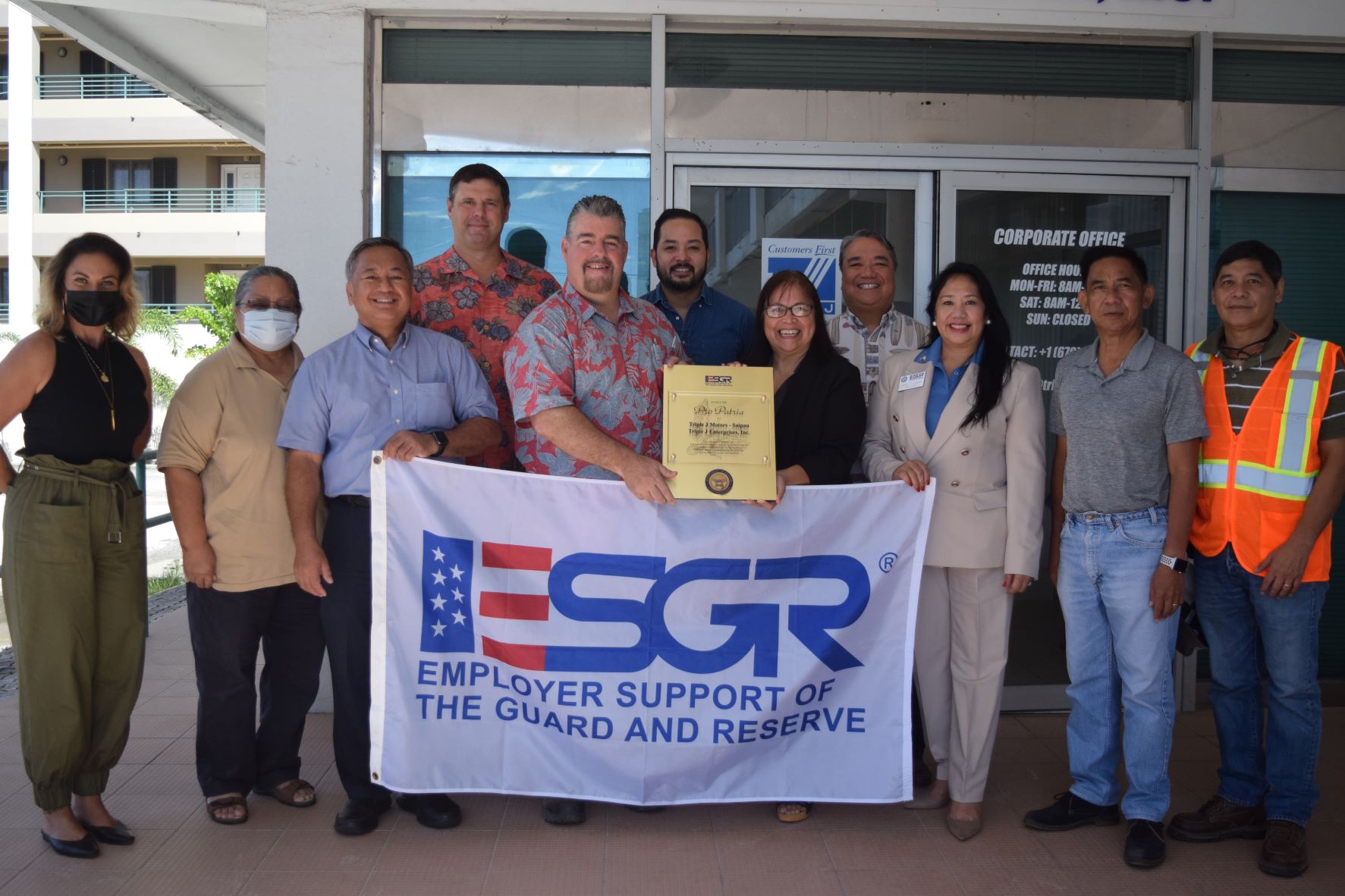 Triple J construction operations manager/senior superintendent Mario Valentino, center, receives the Pro Patria Award from ESGR Guam-CNMI area chair Rita A. Sablan. Also in the photo are ESGR CNMI Ombudsman Joann T. Aquino, second right, chair emeritus and employer outreach coordinator Rose Igitol, and other Triple J officials at the Triple J corporate office in Chalan Kanoa on Wednesday last week.
