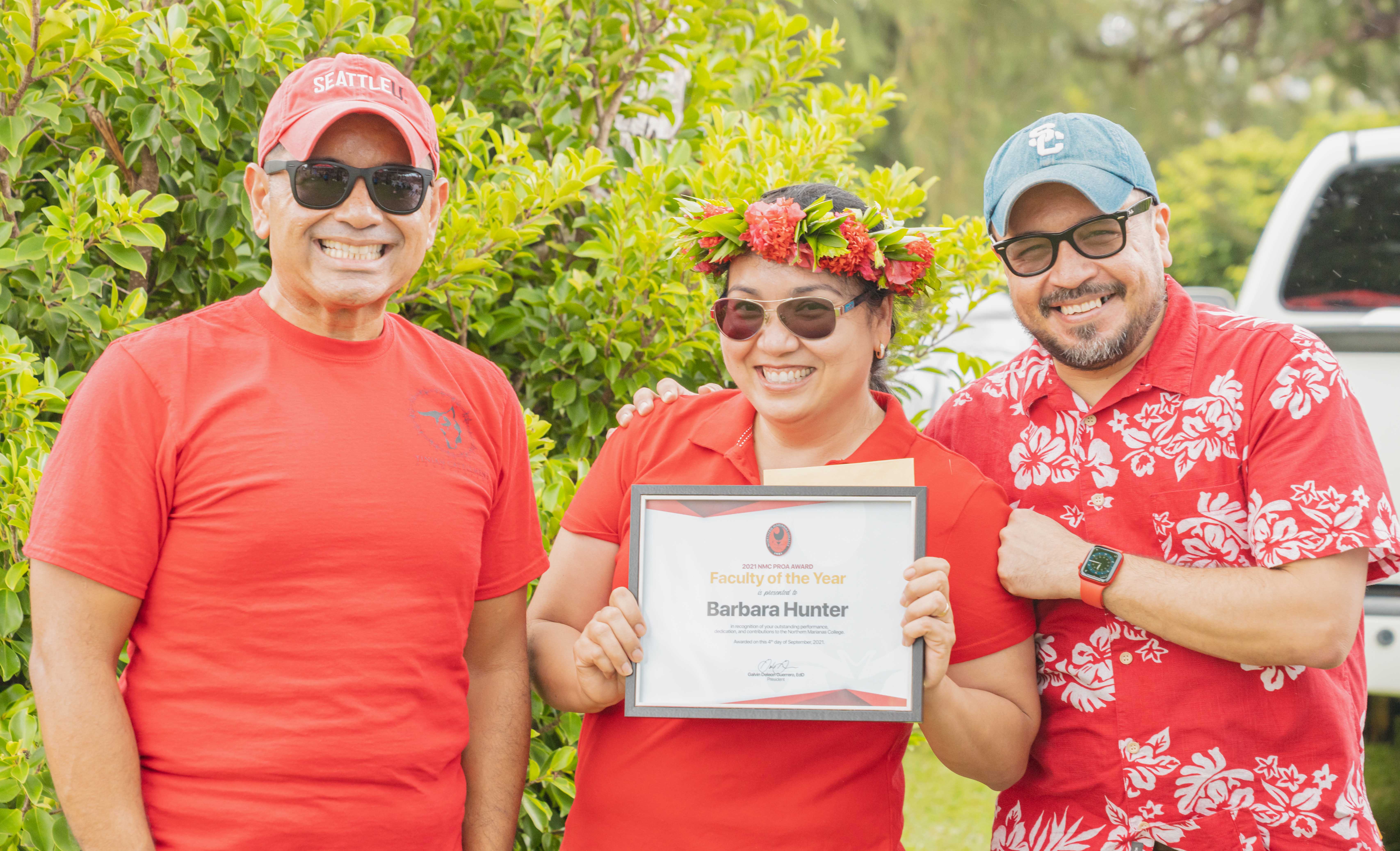Barbara “Bobbie” Hunter, center, was awarded the NMC Faculty of the Year award. In photo with Hunter is NMC Vice President for Administration and Advancement Frankie Eliptico, left, and NMC President Galvin Deleon Guerrero, right.