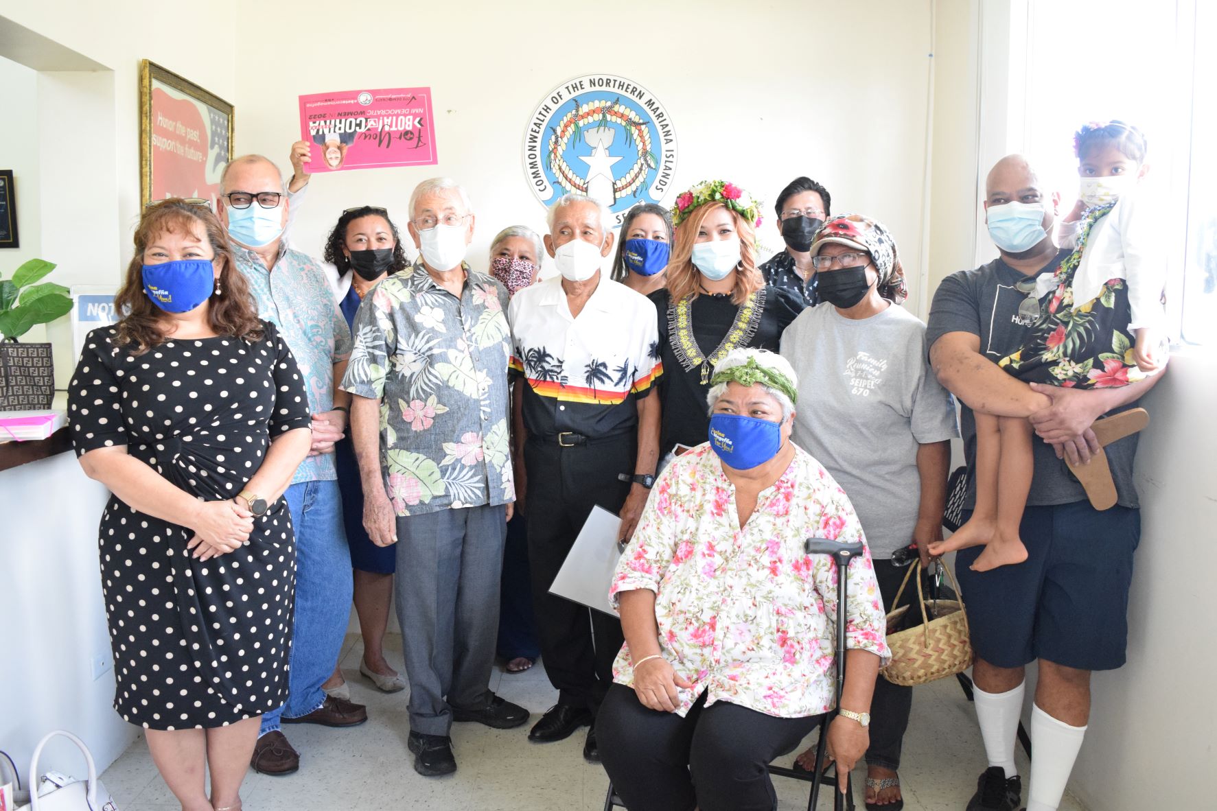 Corina Magofna poses for a photo with U.S. Congressman Gregorio Kilili Camacho Sablan, former Gov. Carlos S. Camacho, former Judge Herbert D. Soll, Democratic members of the Legislature and other supporters.