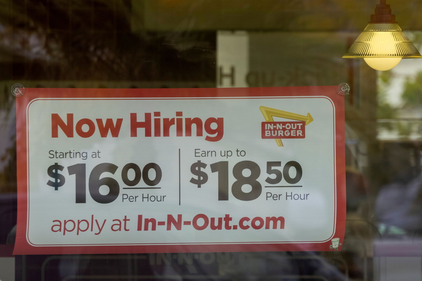 An In-N-Out Burger advertises for workers at their restaurants location in Encinitas, California, on May 10, 2021.