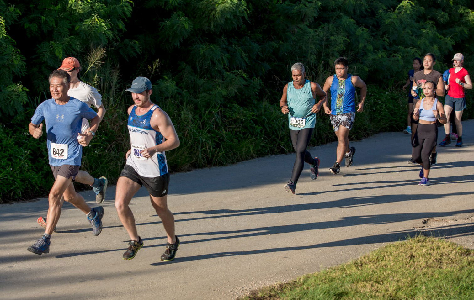 Marshall Hoskins and Chong Nam Lee lead the Run Saipan International Coastal Cleanup event at Ladder Beach on Saturday.
