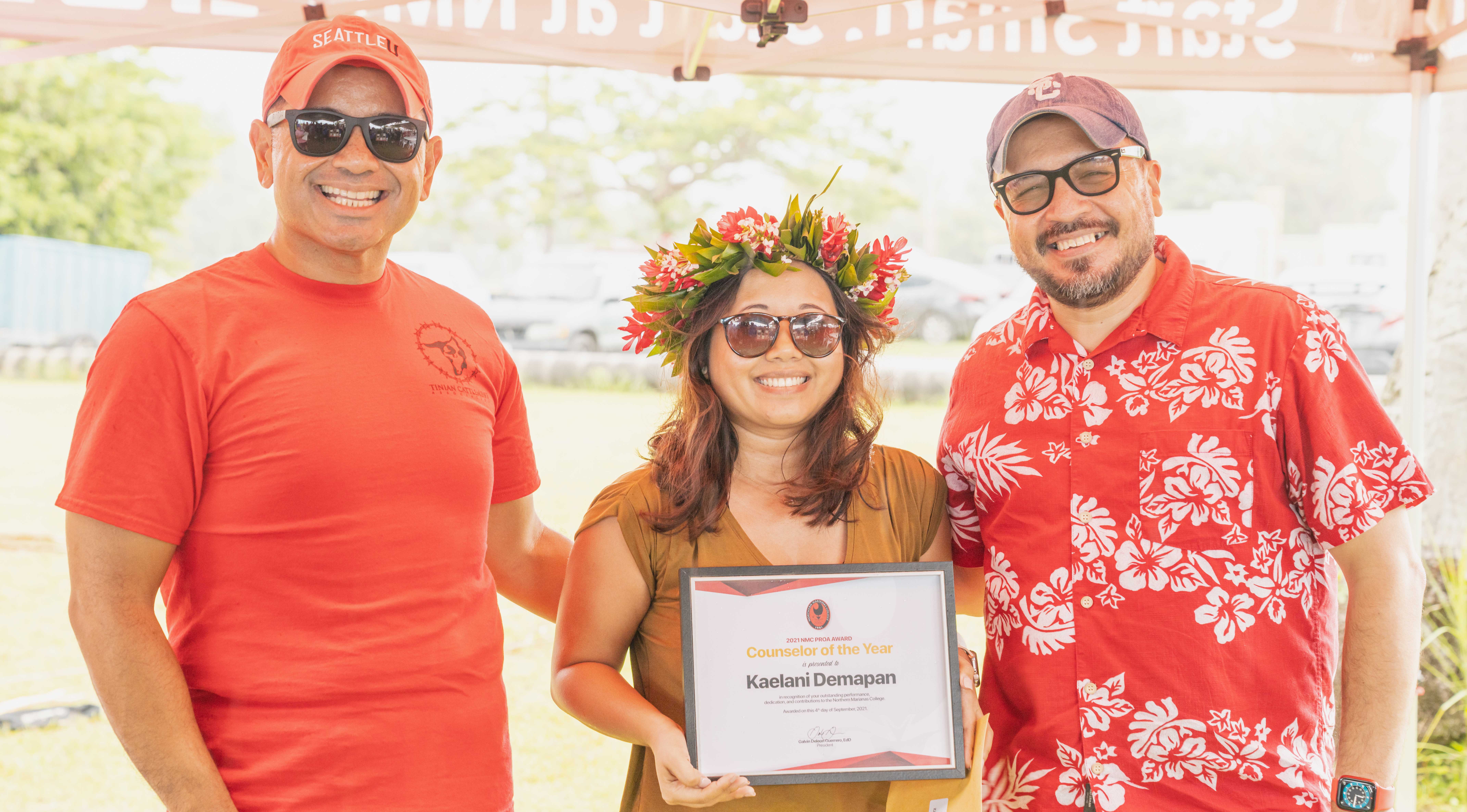 Kaelani Demapan, center, was awarded the NMC Counselor of the Year award. In photo with Demapan is NMC Vice President for Administration and Advancement Frankie Eliptico, left, and NMC President Galvin Deleon Guerrero, right.