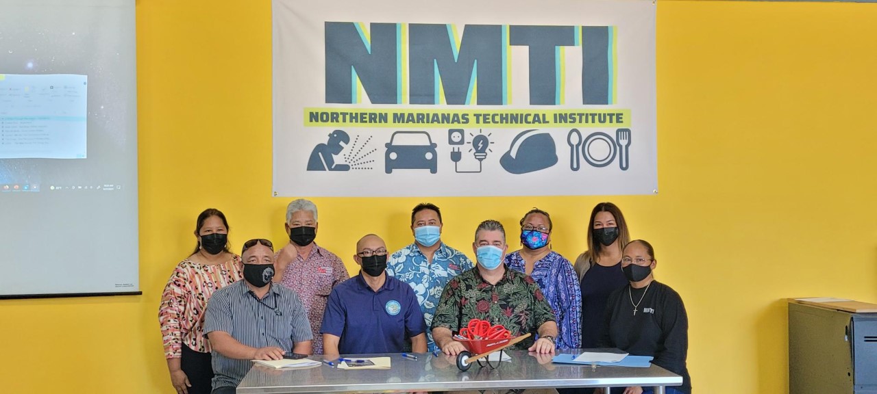 From left, NMTI Trustee Catherine Attao-Toves, NMHC CDBG-DR program manager Kimo Rosario, Lt. Gov. Arnold I. Palacios, NMHC corporate director, Gov. Ralph DLG Torres, NMTI board chair Mario Valentino, Trustee Carmelita Faisao, Trustee Ana Mendiola, and NMTI interim CEO Jodina Attao pose for a photo following the signing of an scholarship program agreement between NMTI and NMHC.