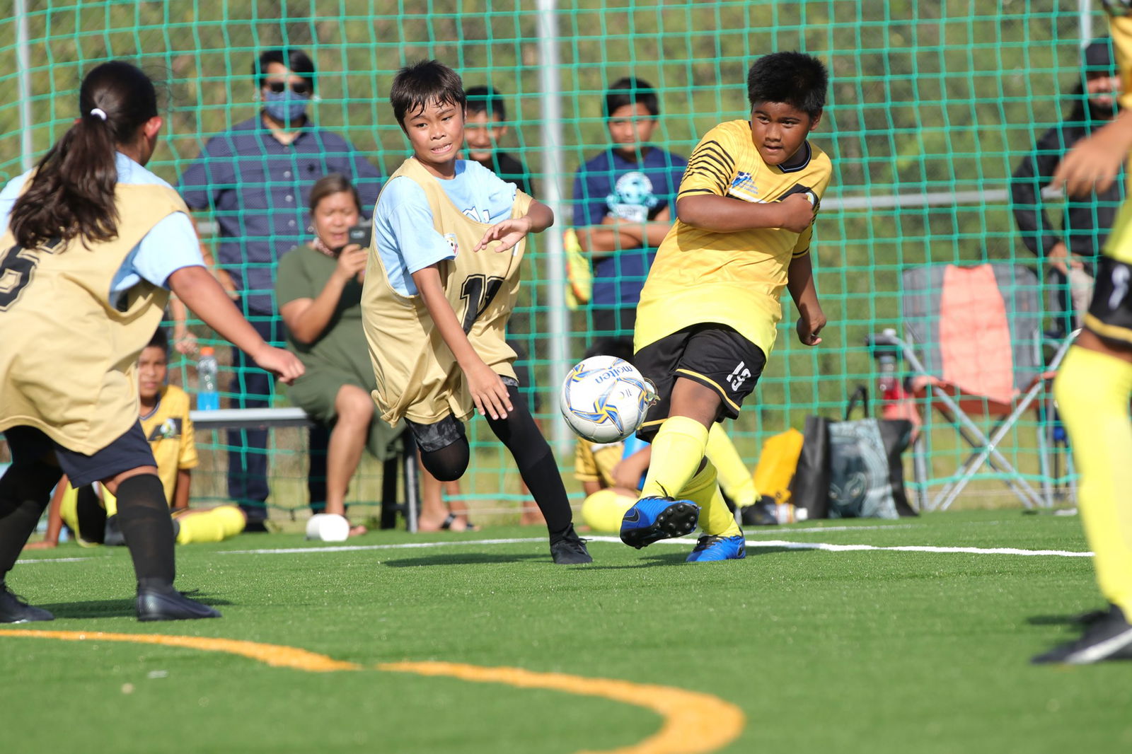A San Vicente Elementary School player takes a shot during an NMIFA-PSS Interscholastic Soccer League Elementary Division game at the NMI Soccer Training Center.