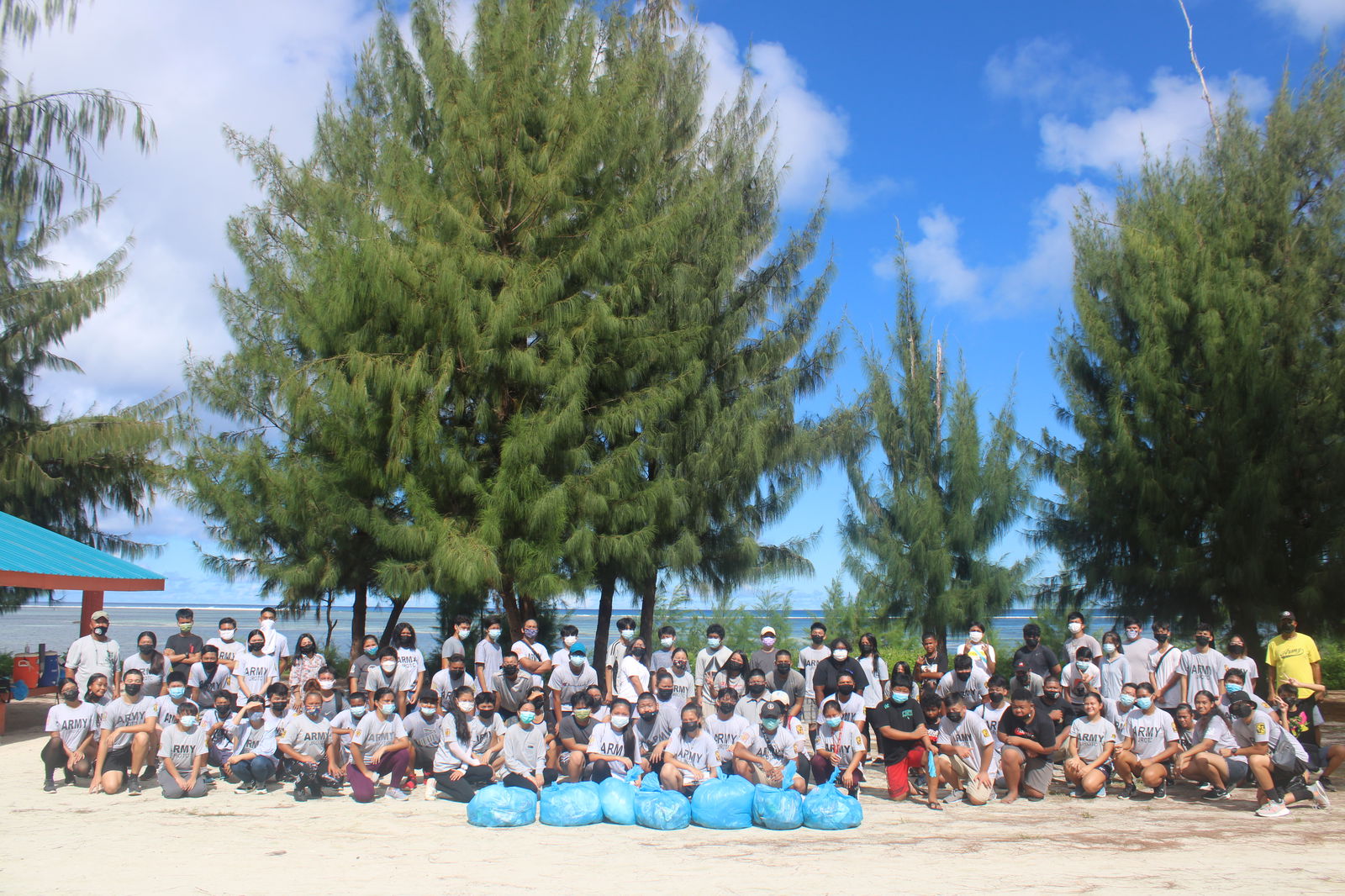 The Manta Ray Battalion cadets pose for a photo after picking up trash.