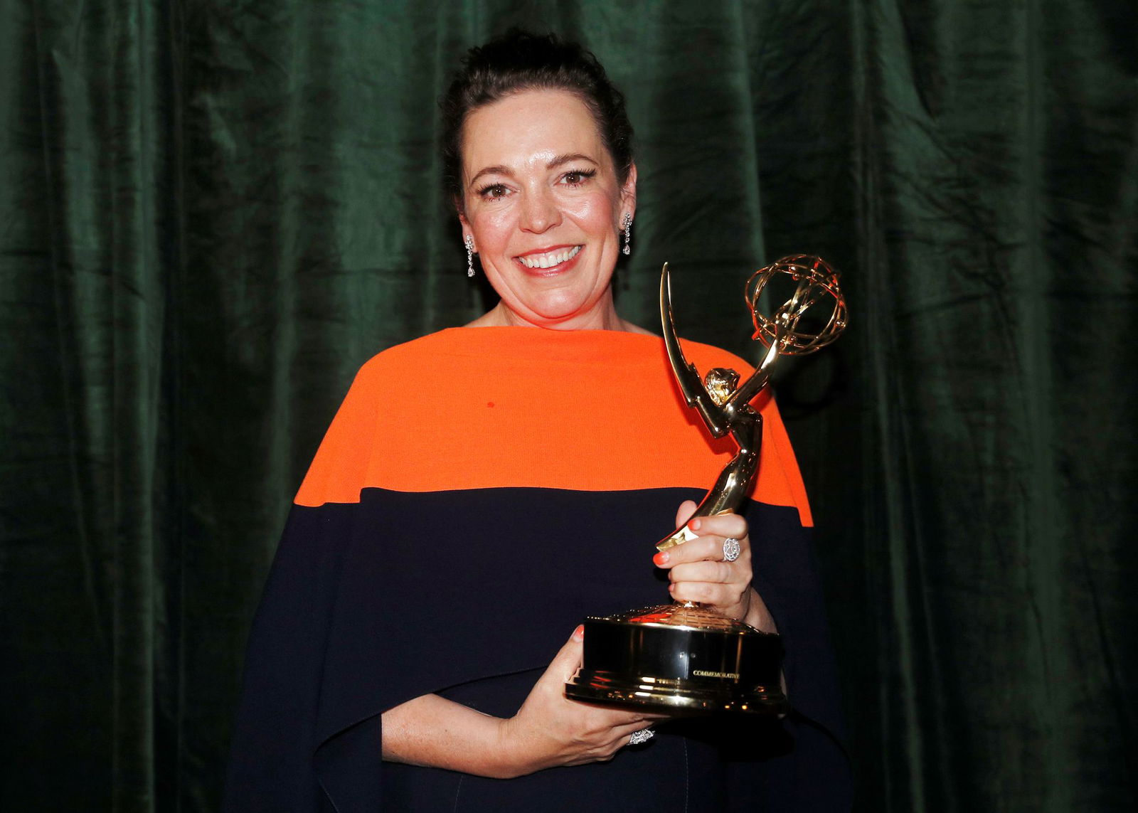 Olivia Colman poses with her Emmy award for Outstanding Lead Actress in a Drama Series, backstage at the Netflix UK Primetime Emmy for "The Crown" in London, Britain on Sept. 20, 2021.