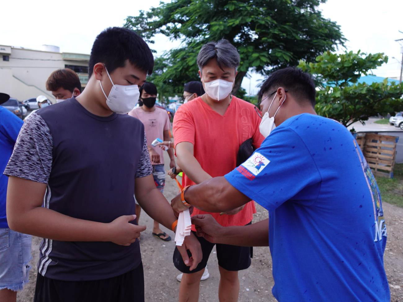 Festivalgoers undergo temperature checks and must wear masks at the Marianas Visitors Authority's Taste of the Marianas International  Food Festival & Beer Garden.