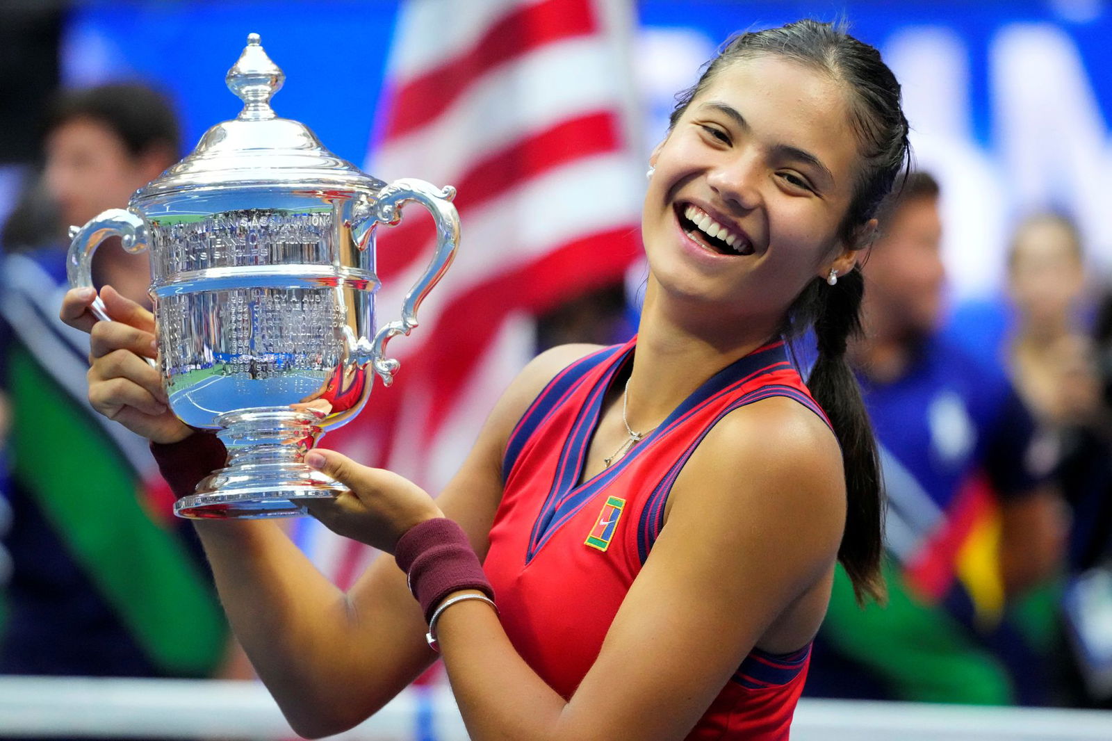 Emma Raducanu of Great Britain celebrates with the championship trophy after her match against Leylah Fernandez of Canada in the women's singles final on day 13 of the 2021 U.S. Open tennis tournament at USTA Billie Jean King National Tennis Center in Flushing, NY on Sept. 11, 2021.