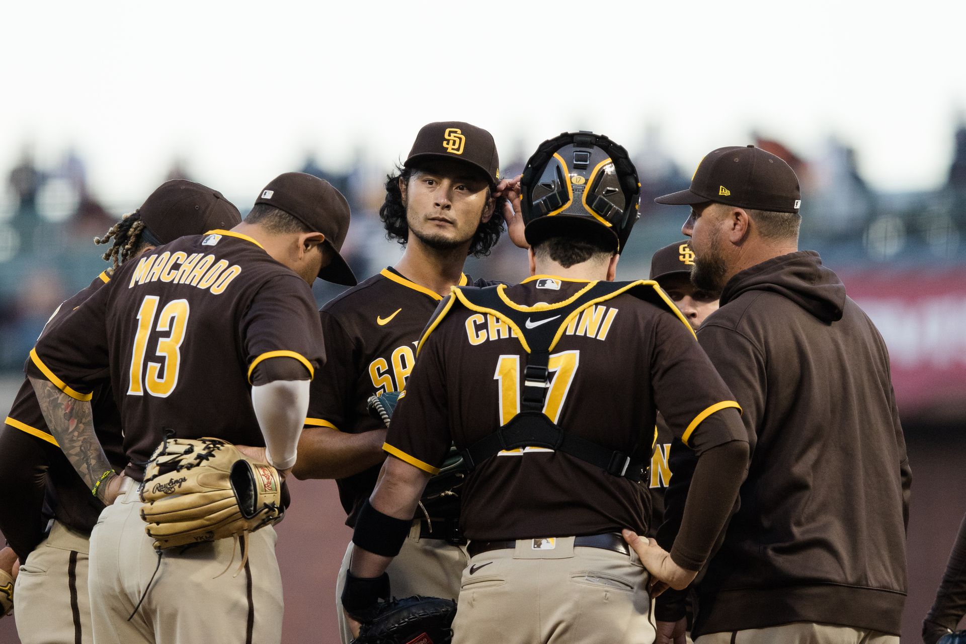 San Diego Padres interim pitching coach Ben Fritz (53) talks to starting pitcher Yu Darvish (11) after he allows two runs by the San Francisco Giants in the first inning at Oracle Park in San Francisco, California on Sept. 13, 2021.