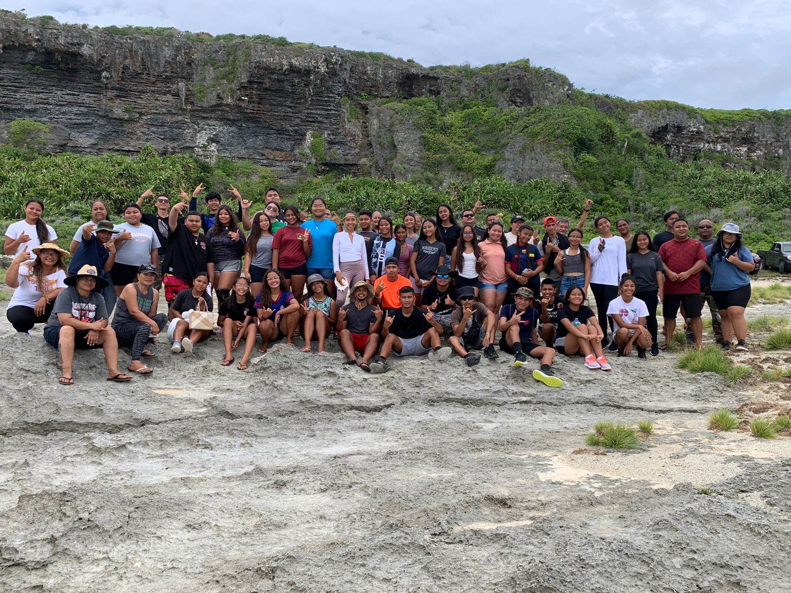 Inafa'maolek Manhoben Marianas youth and staff gather for a photo at As Matmos Cliff.