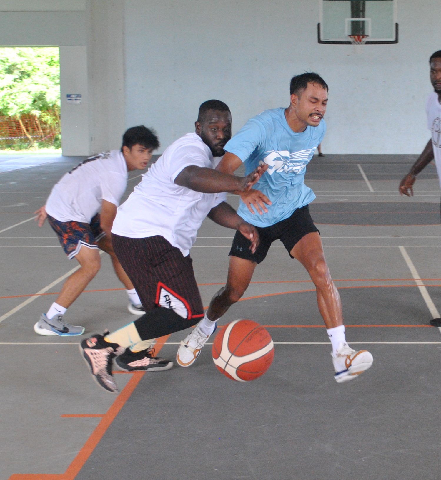 The Game's Richard McWilliams chases after the loose ball during the championship game of the NMI Rollers Basketball Association Men's Tournament at the Koblerville gym on Sunday.