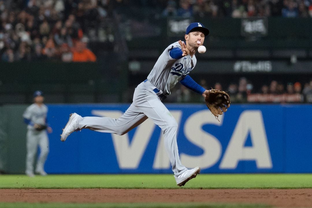 Los Angeles Dodgers shortstop Trea Turner (6) tosses the ball to first base against the San Francisco Giants during the fifth inning at Oracle Park in San Francisco, California on Sept. 4, 2021.