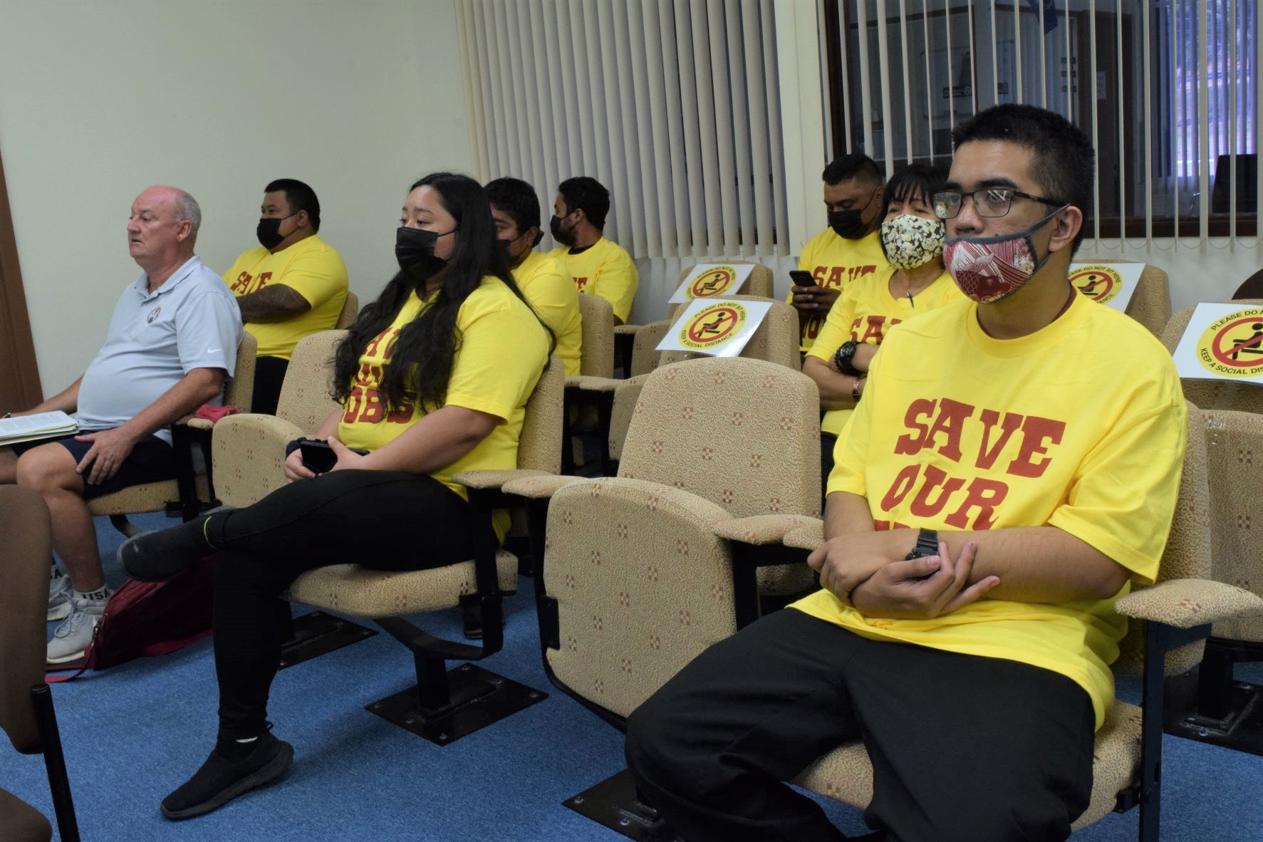 MP Holdings LL and Mariana Entertainment LLC consultant, Gus Noble, left, and employees of Club 88 and Saipan Vegas attend a Saipan and Northern Islands Legislative Delegation session last month in the House chamber.