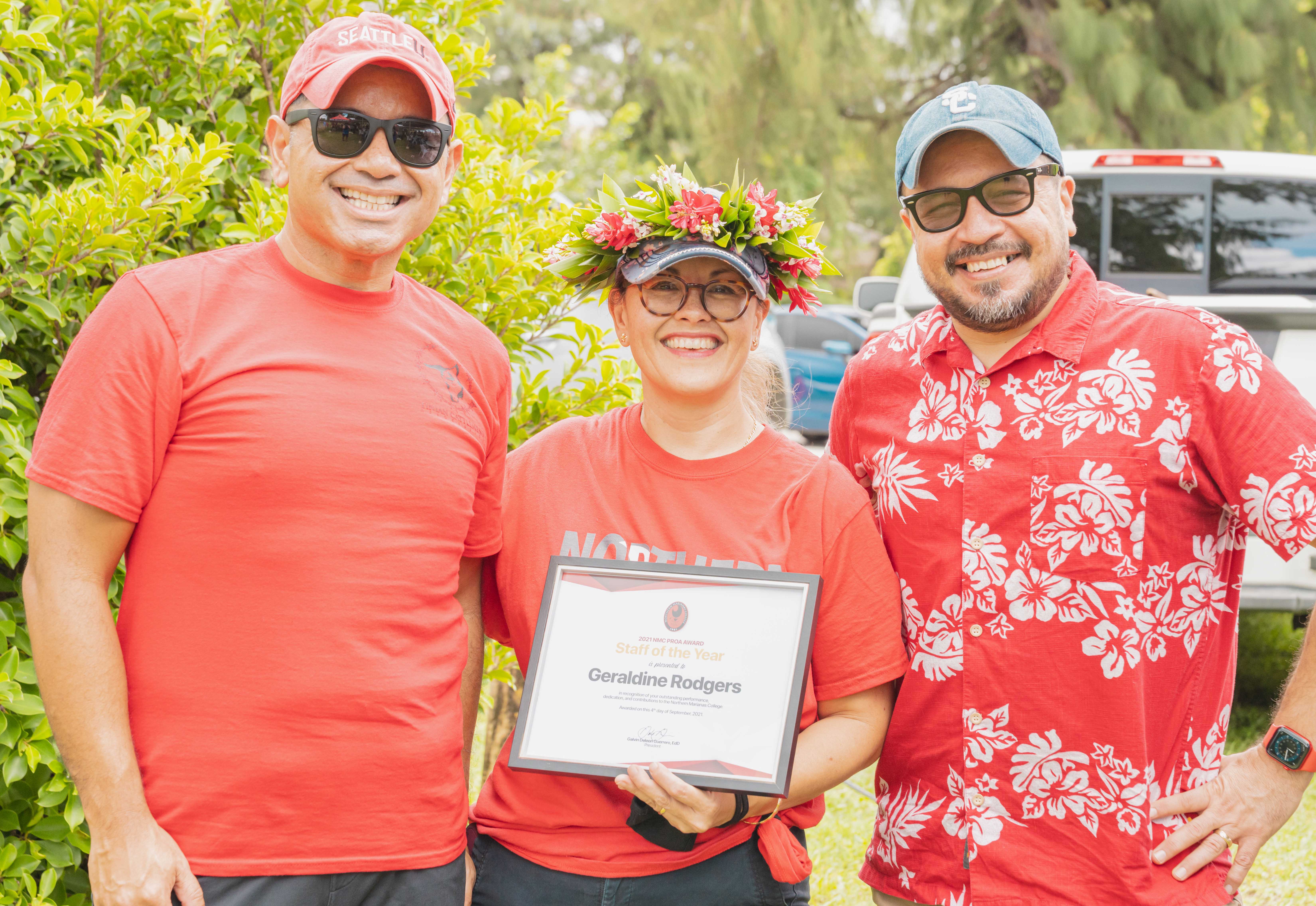 Geraldine “Geri” Rodgers, center, was awarded the NMC Staff of the Year award. In photo with Rodgers is NMC Vice President for Administration and Advancement Frankie Eliptico, left, and NMC President Galvin Deleon Guerrero, right.