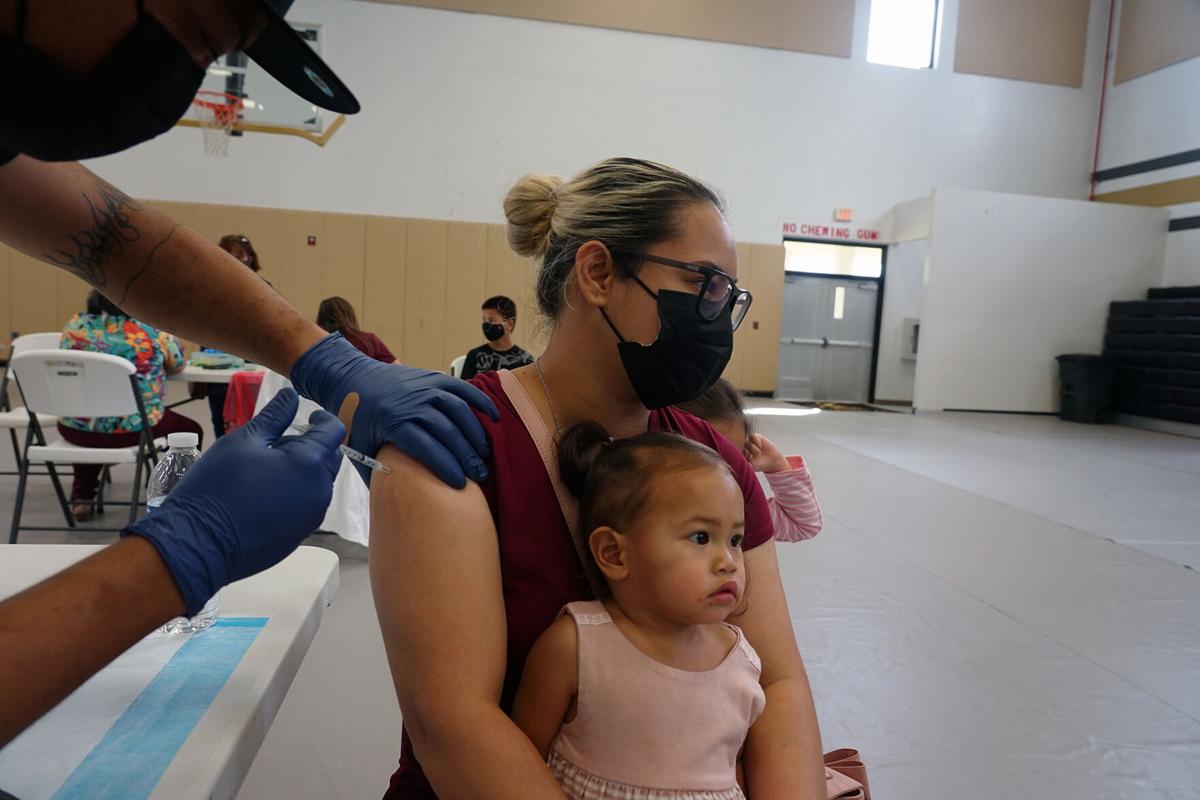 Tiriah Guerrero gets her second shot of the Pfizer Covid-19 vaccine at the Tiyan High School gym on Saturday morning.