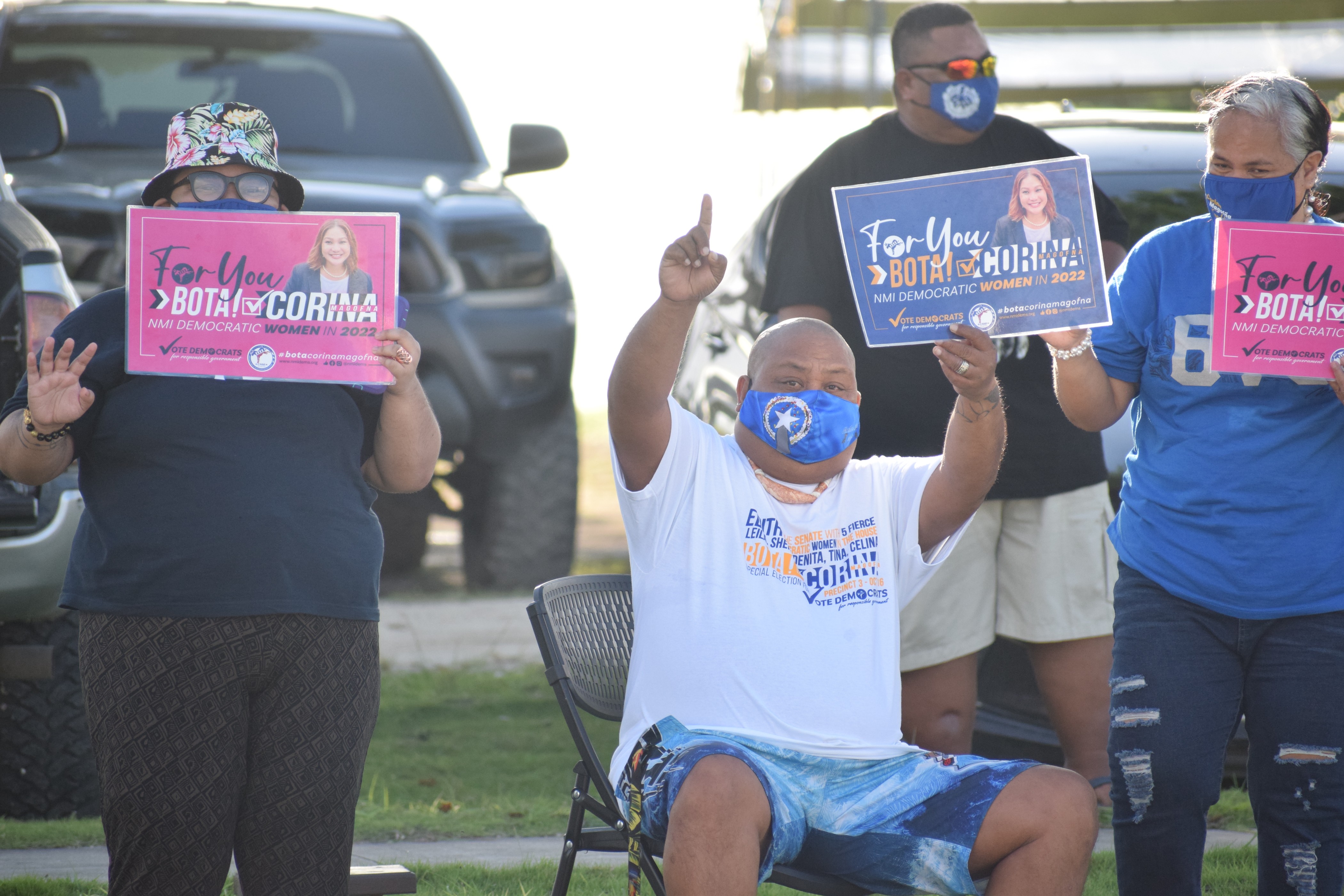 Corina's supporters display campaign signs.