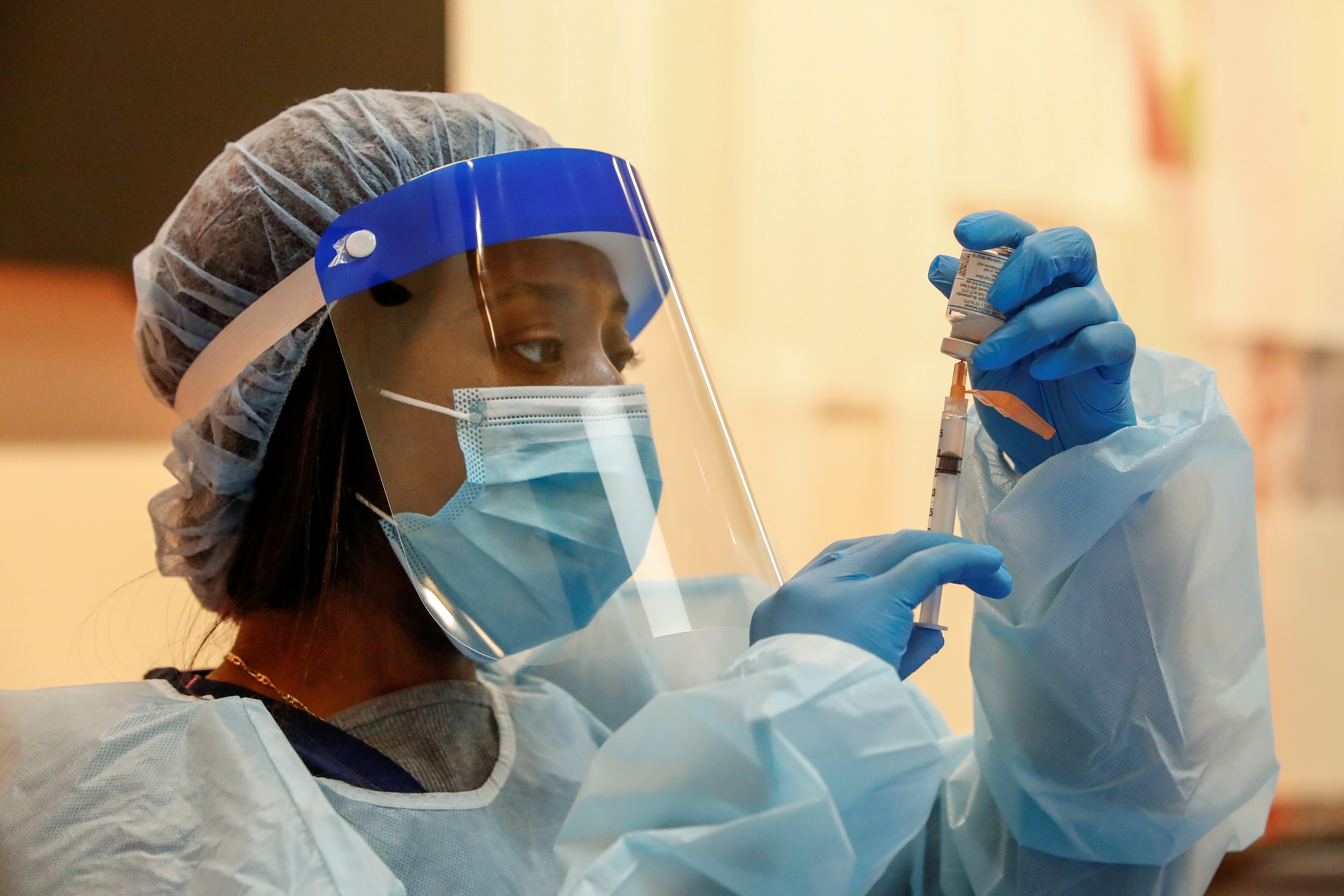 Medical assistant Mariasha Davis draws the Moderna Covid-19 vaccine into a syringe before people are inoculated at Trinity United Church of Christ in Chicago, Illinois on Feb. 13, 2021.