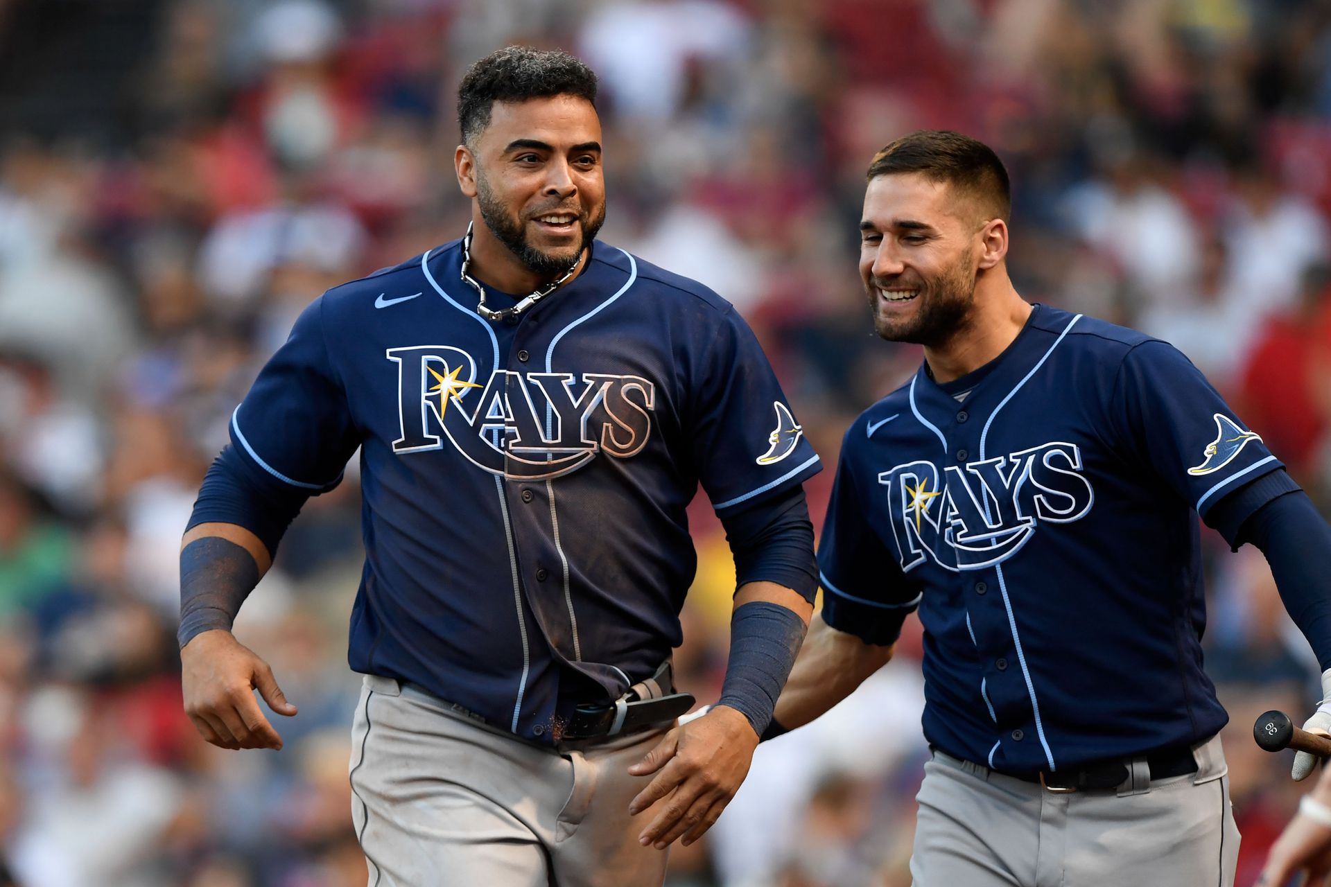 Tampa Bay Rays designated hitter Nelson Cruz (23) celebrates with center fielder Kevin Kiermaier (39) after scoring a run against the Boston Red Sox during the tenth inning at Fenway Park in Boston, Massachusetts on Sept. 6, 2021.
