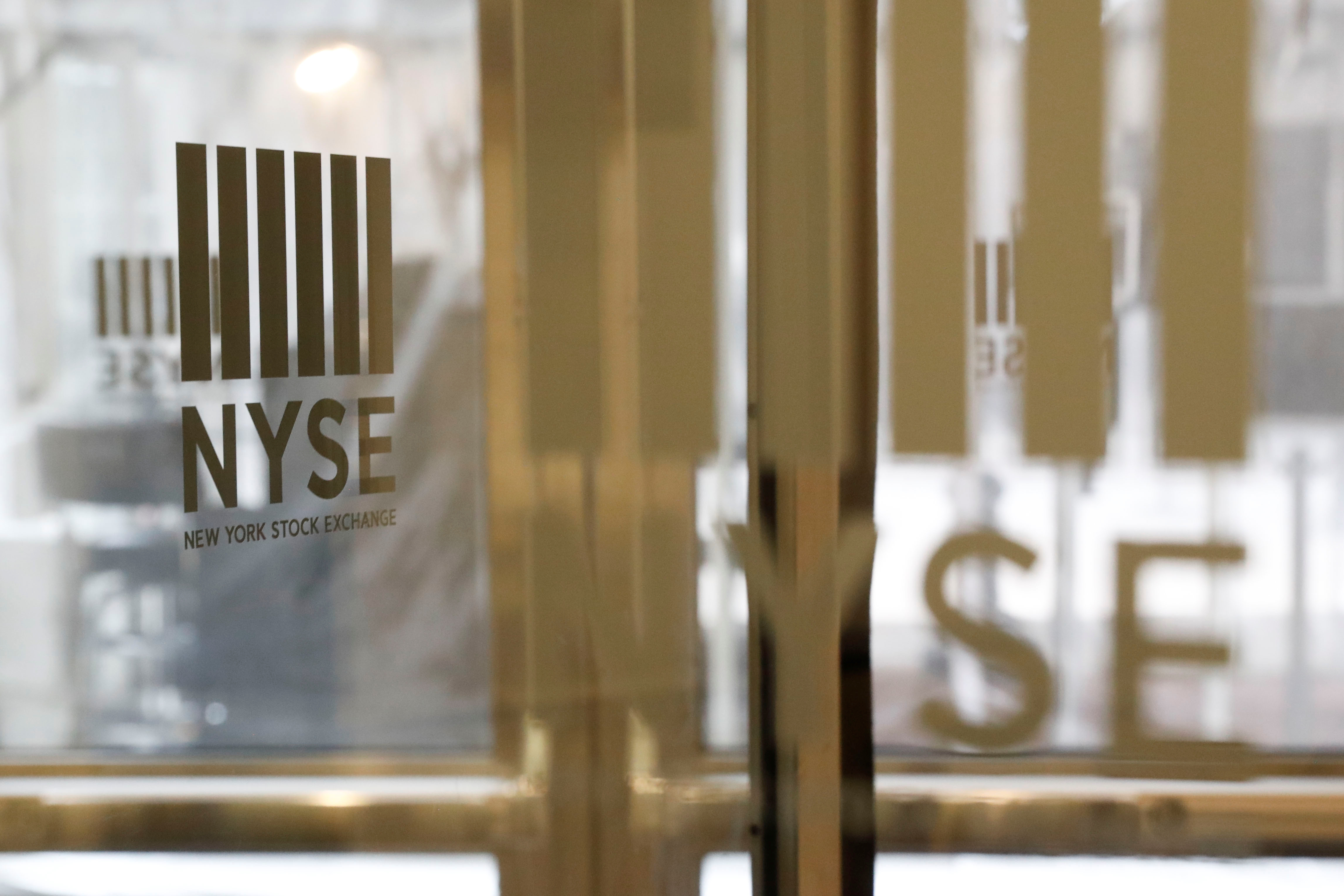 The logo of the New York Stock Exchange is seen on the door in New York on March 18, 2020.