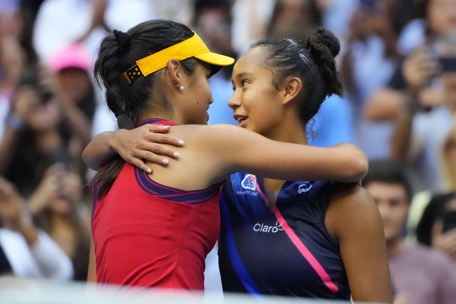 Emma Raducanu of Great Britain, left, hugs Leylah Fernandez of Canada after their match in the women's singles final of the 2021 U.S. Open tennis tournament at USTA Billie Jean King National Tennis Center.