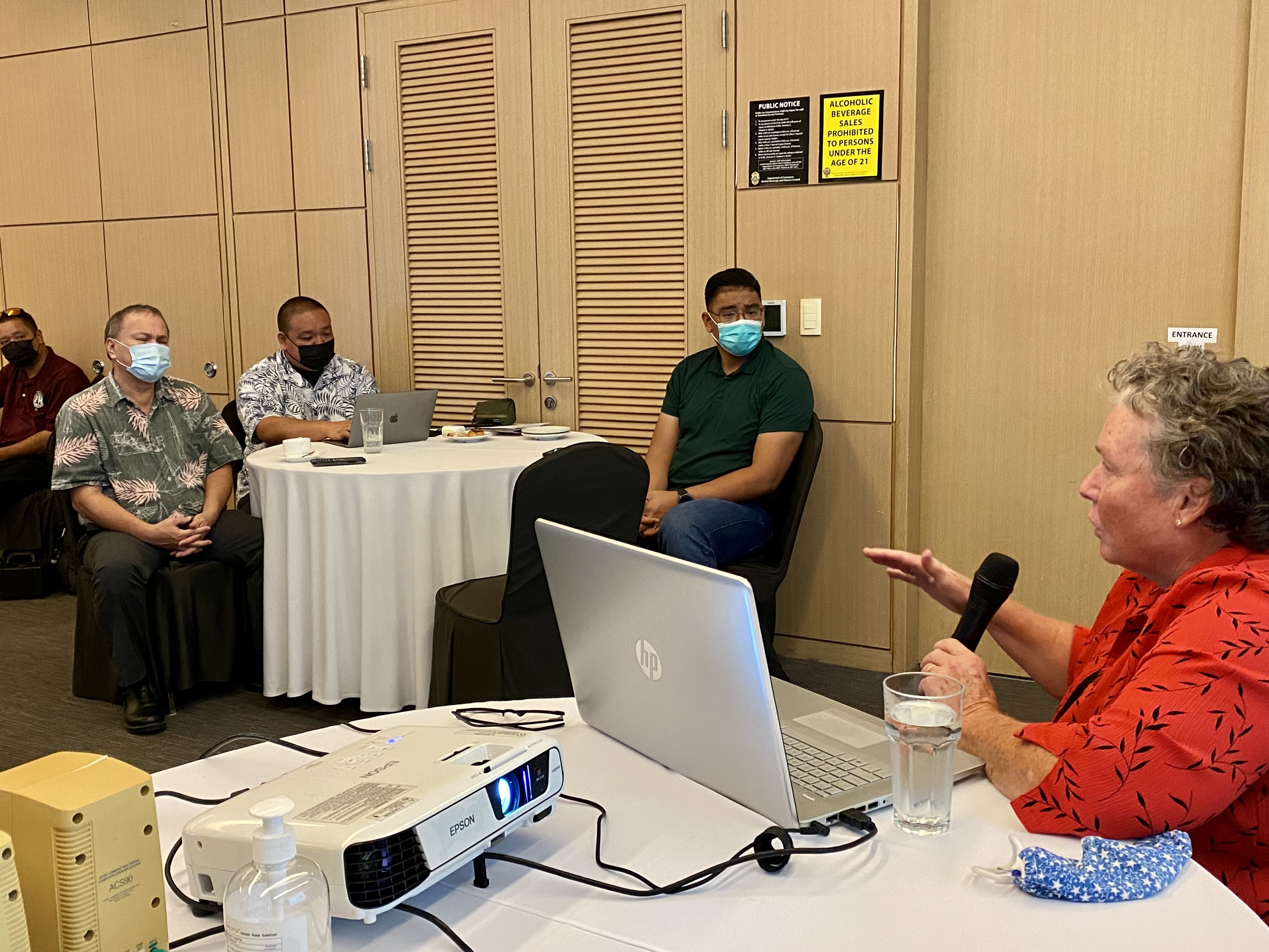 Board of Education Chairman Andrew L. Orsini, Acting Commissioner of Education Eric Magofna and BOE member Antonio Borja listen to Peggy Feldmann of DBDriven, a Virginia-based next generation data and information warehouse.